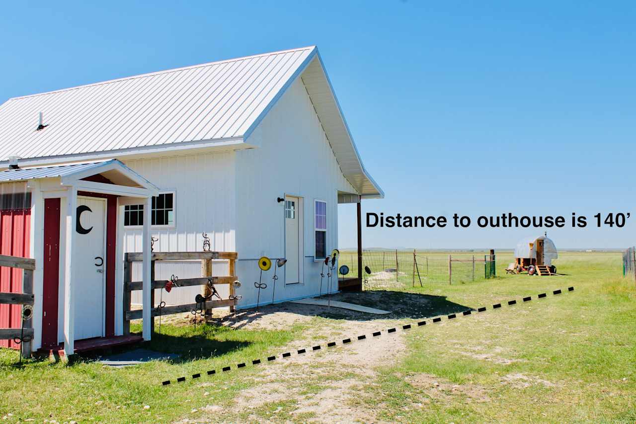 The outhouse is just a short walk from the sheepwagon past our garden and bunkhouse. The bunkhouse is vacant. 