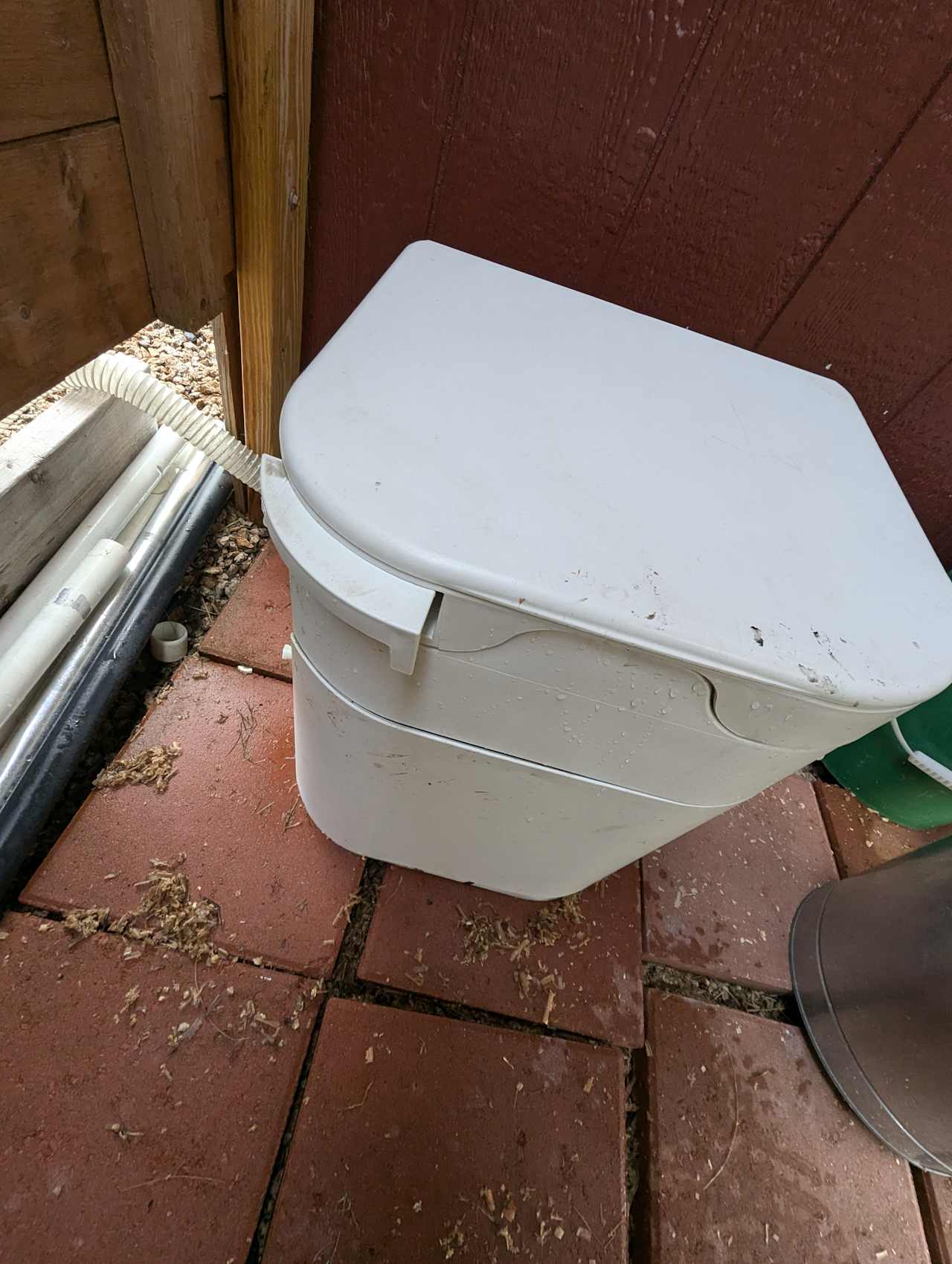 OGO composting toilet. Pull lever out to open the hole