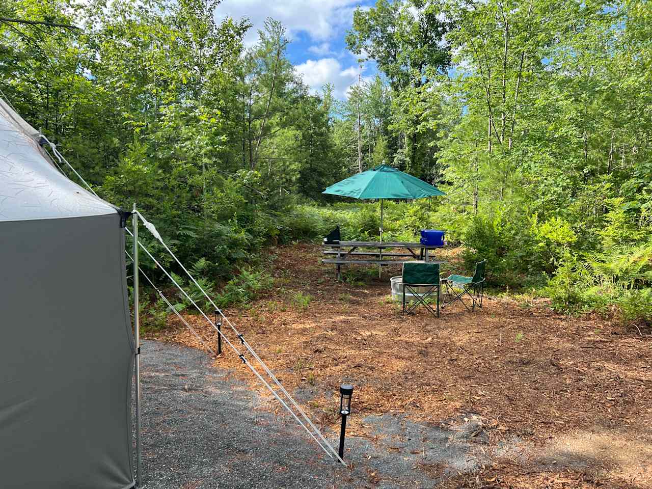 Site #2 Very private site with tent, picnic table, fire, ring, chairs, chemical, toilet, sun, umbrella, trashcan