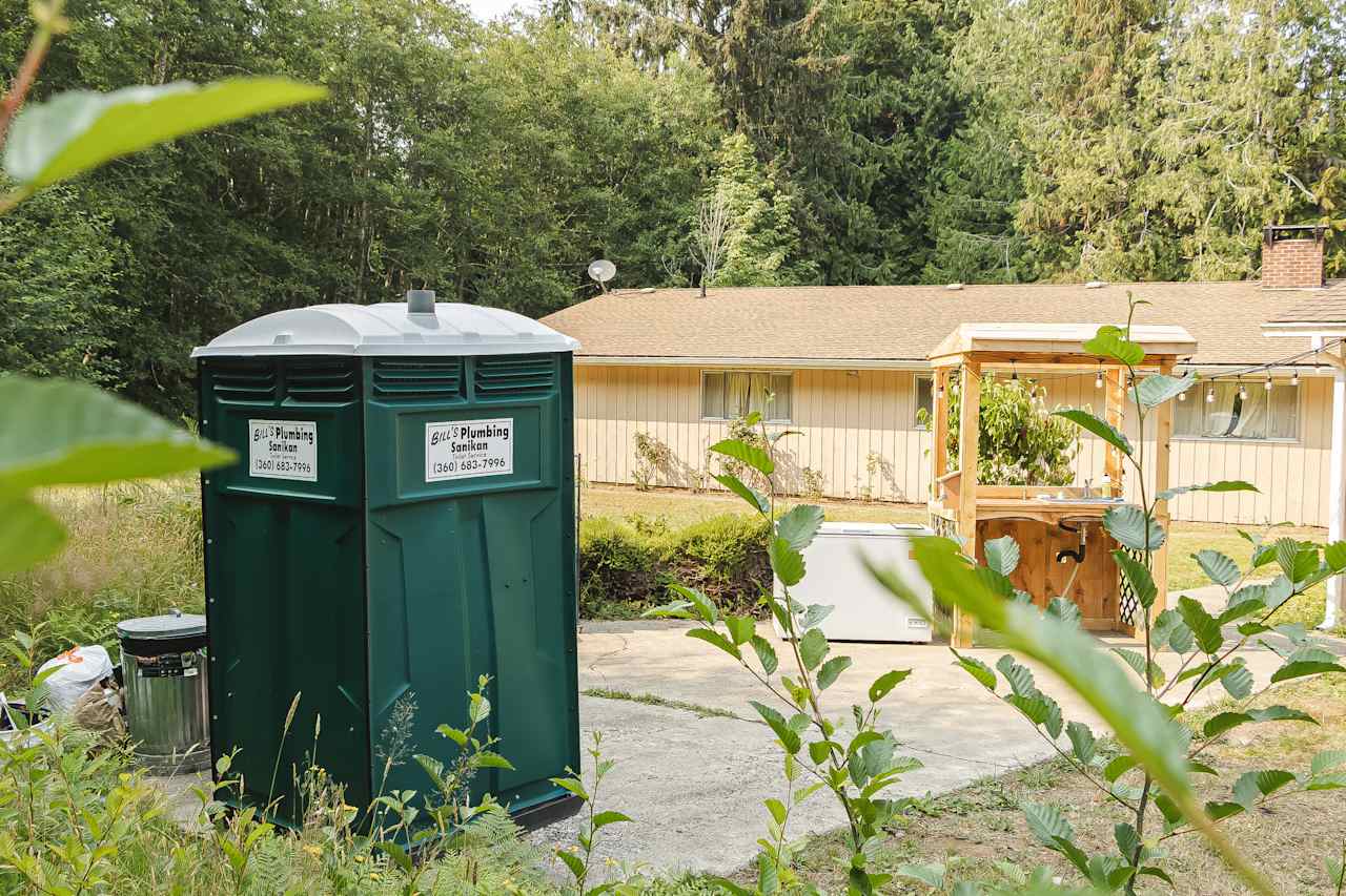 Port-a-pottie with wash station