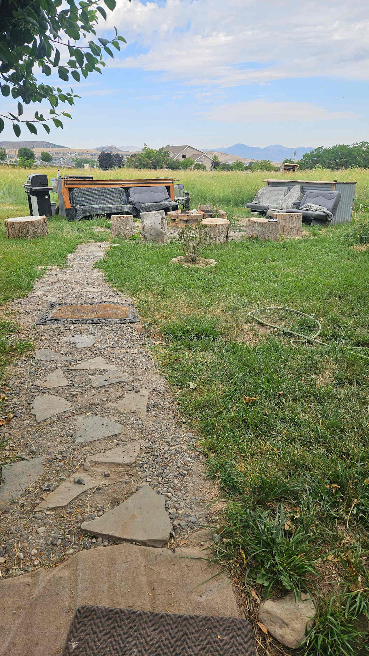 Awesome fireplace and seats out in the open, with the grill we used for cooking or dinners close by!