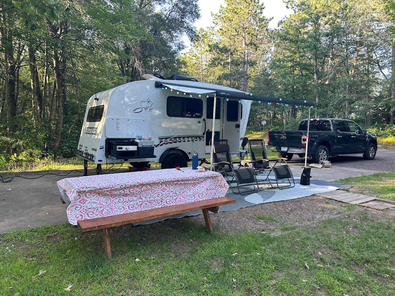 Offered a picnic table and charcoal grill 