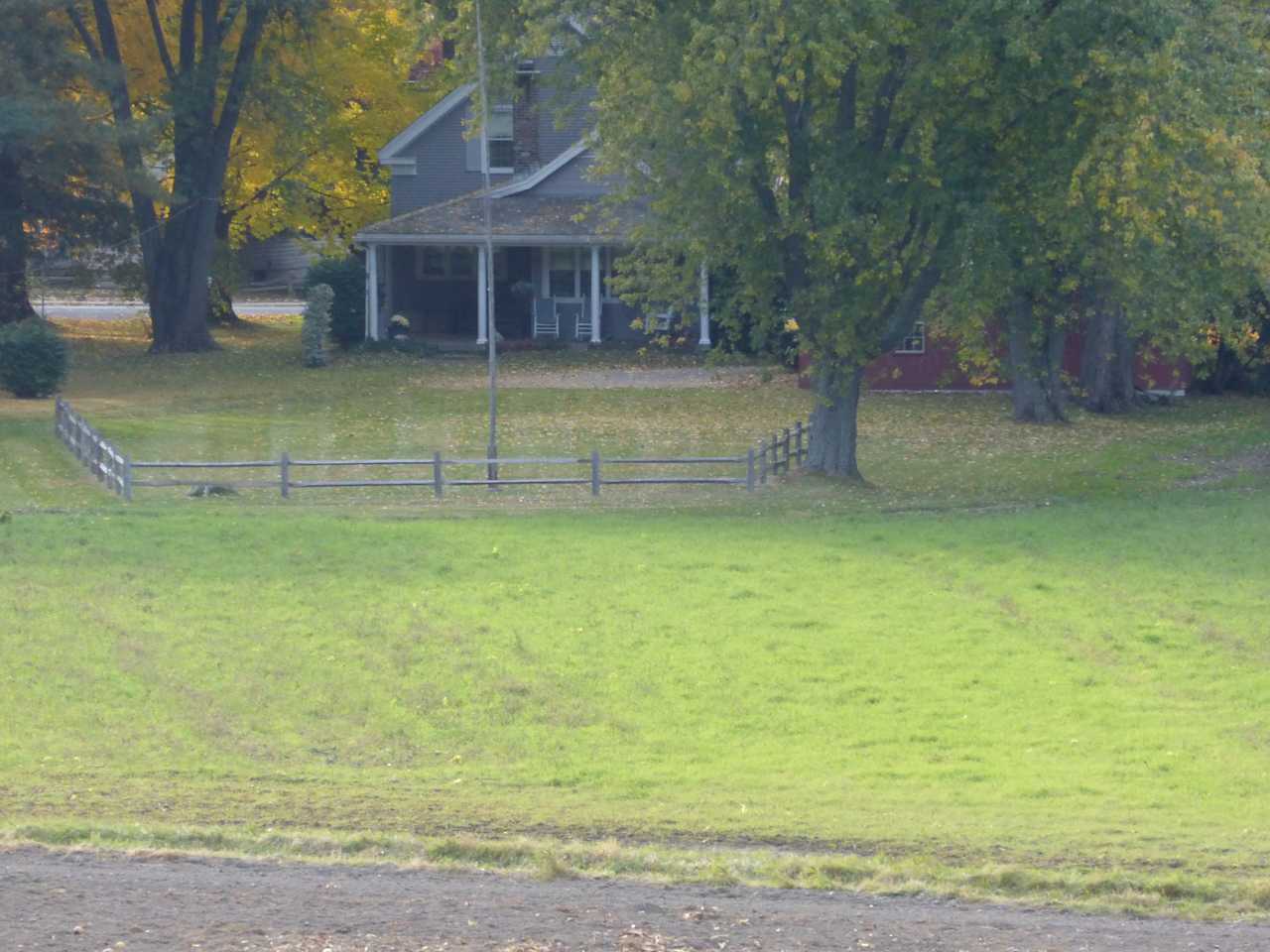 View of back of house and yard from mountain pasture