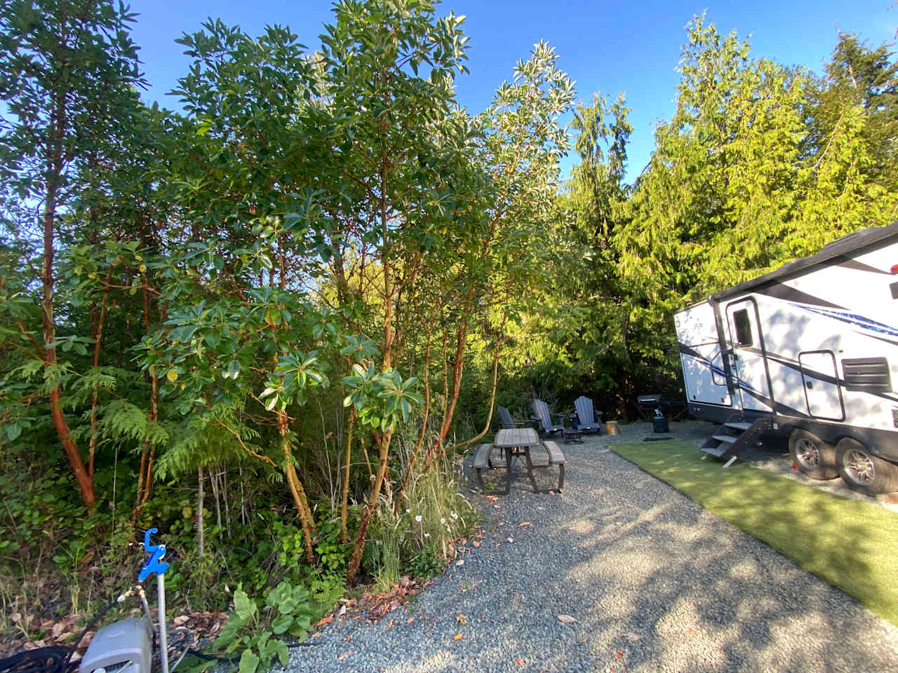 Your own private space with Picnic table, Adirondack chairs, outdoor kitchen stocked with sink, bbq, and refrigerator. Warm up to the propane fire pit . 