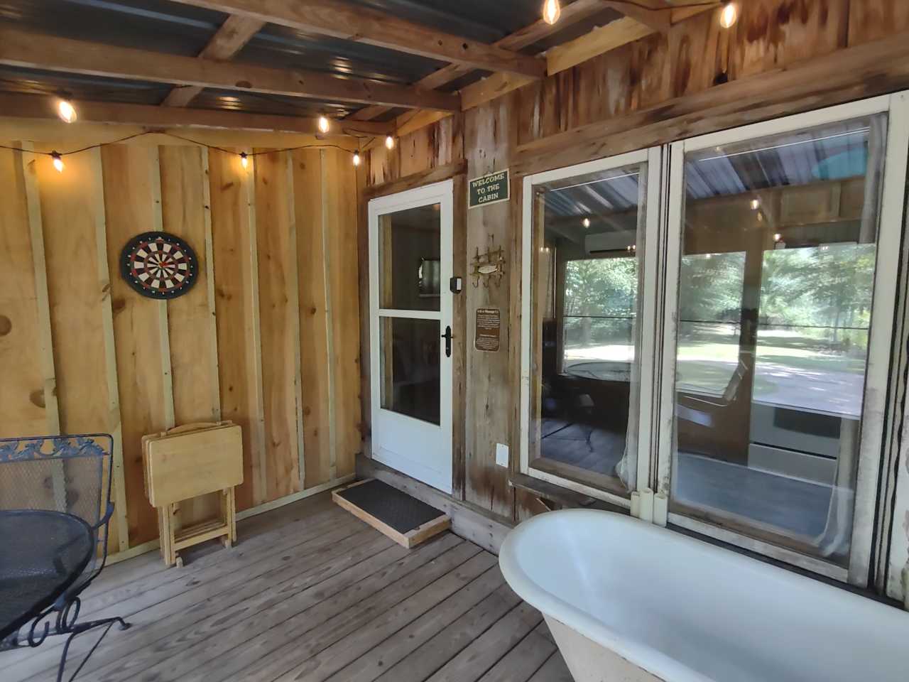 The screened-in porch provides protection from bugs and rain and includes an antique tub! (Privacy note: Although this spot is secluded, we recommend caution when getting in or out of the tub if people are stopped on the opposite side of the river. It's usually not a problem though!)