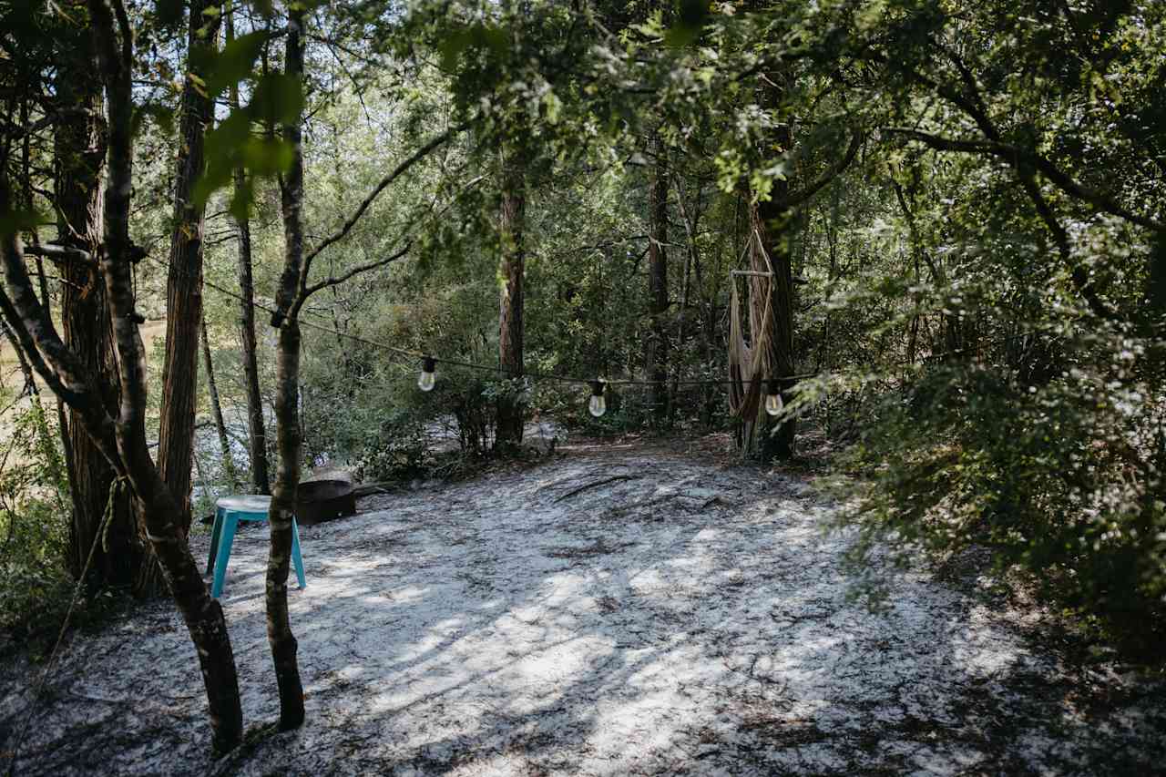 Site #5 overlooks the river and is nice and flat for tent campers.