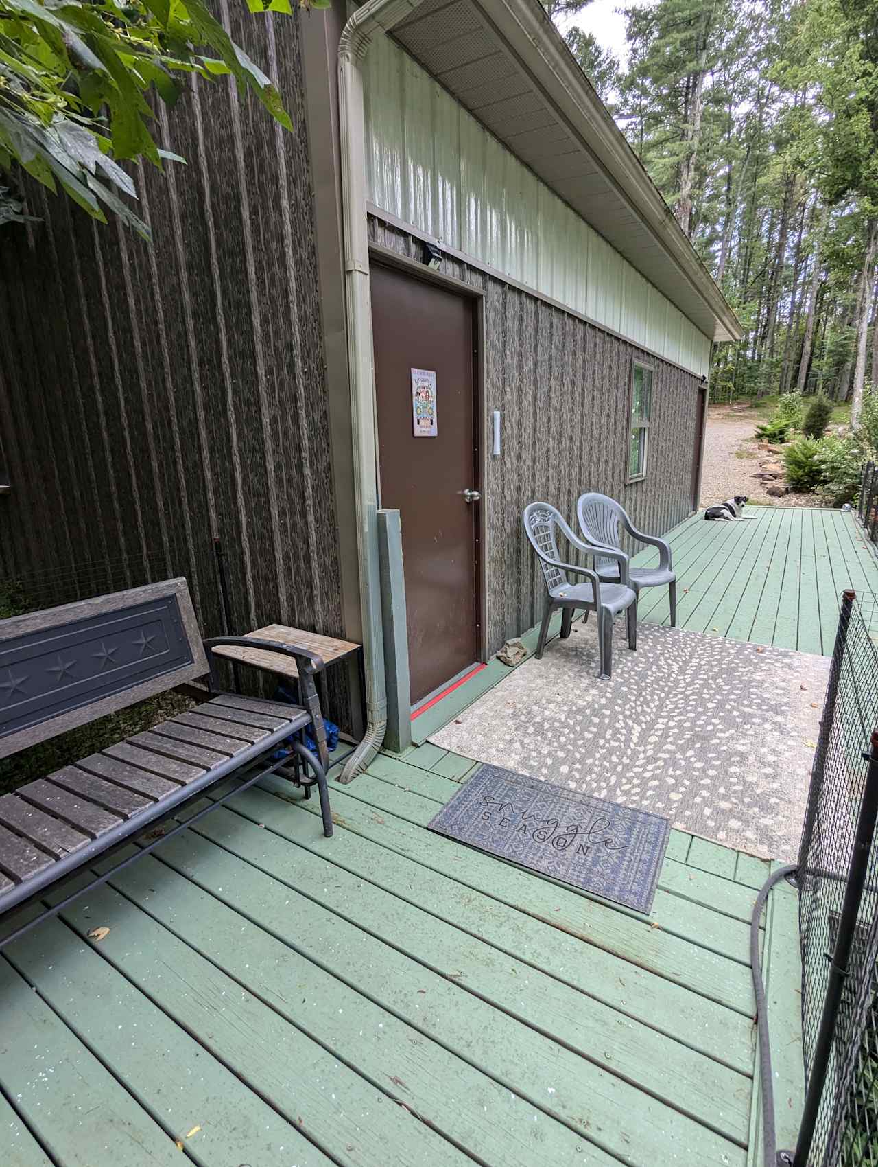 *Glider loveseat under a tulip tree and
 * two chairs on the back deck