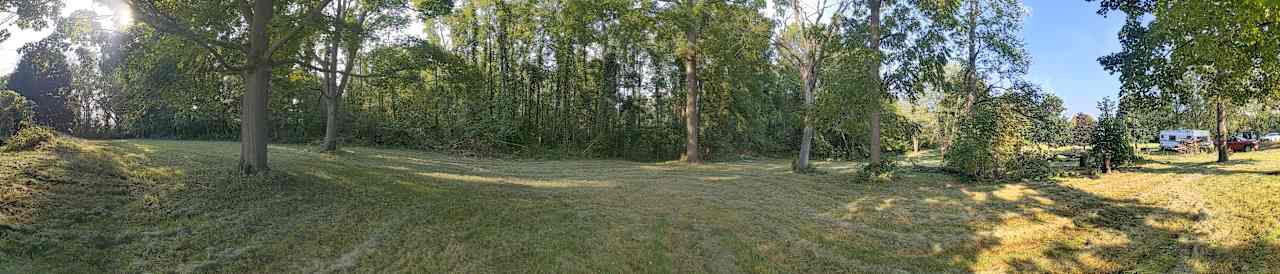 Cow paddock to the L, side of house/land to R of this view