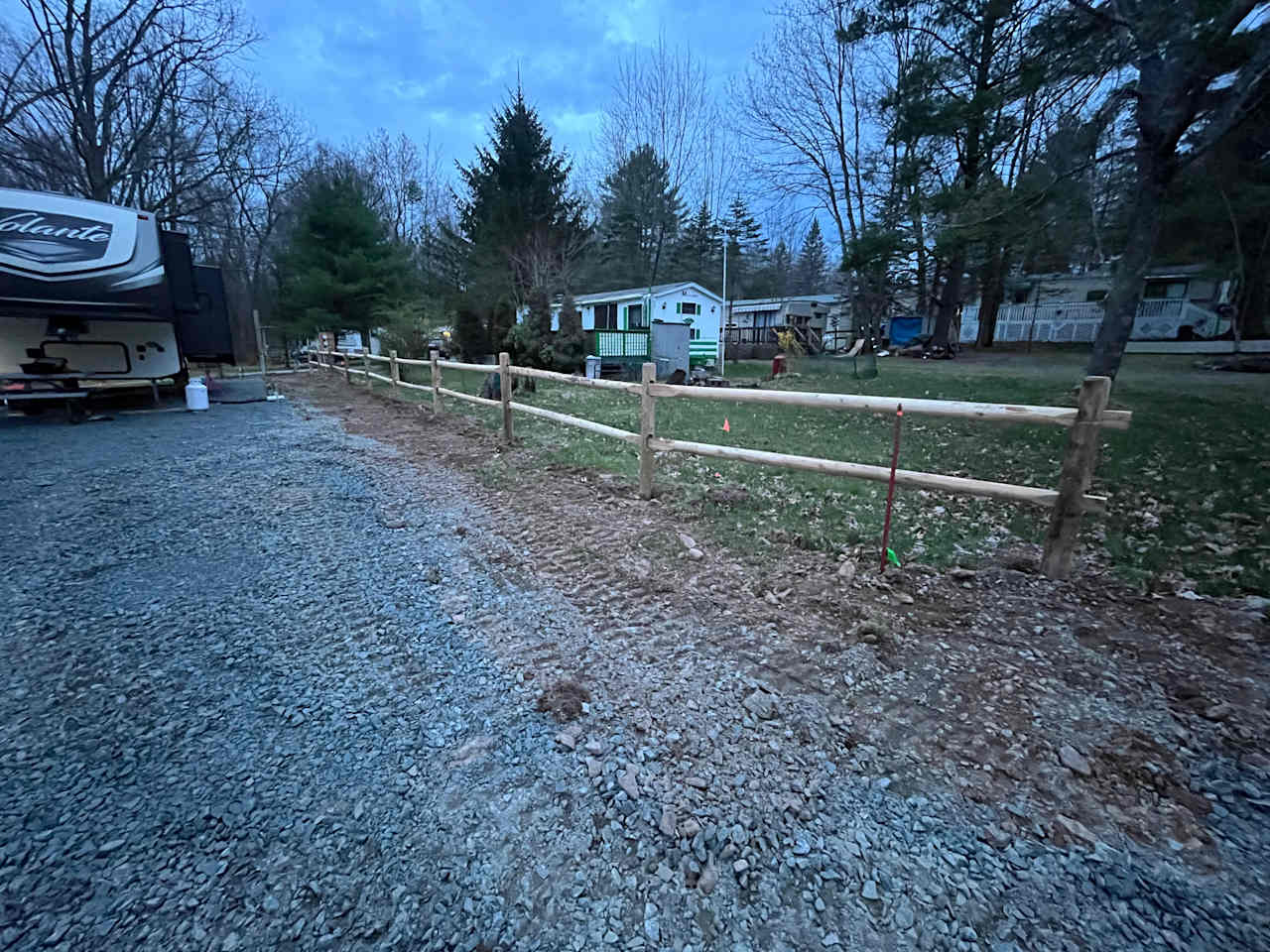 Lot edged with post & rail fence

