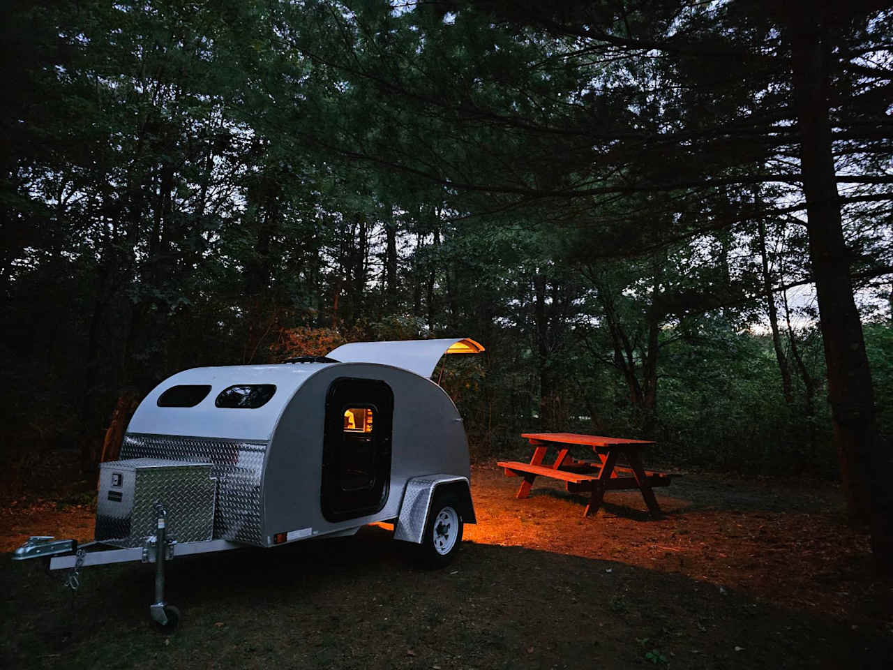 Teardrop camping in campsite #1 at night 