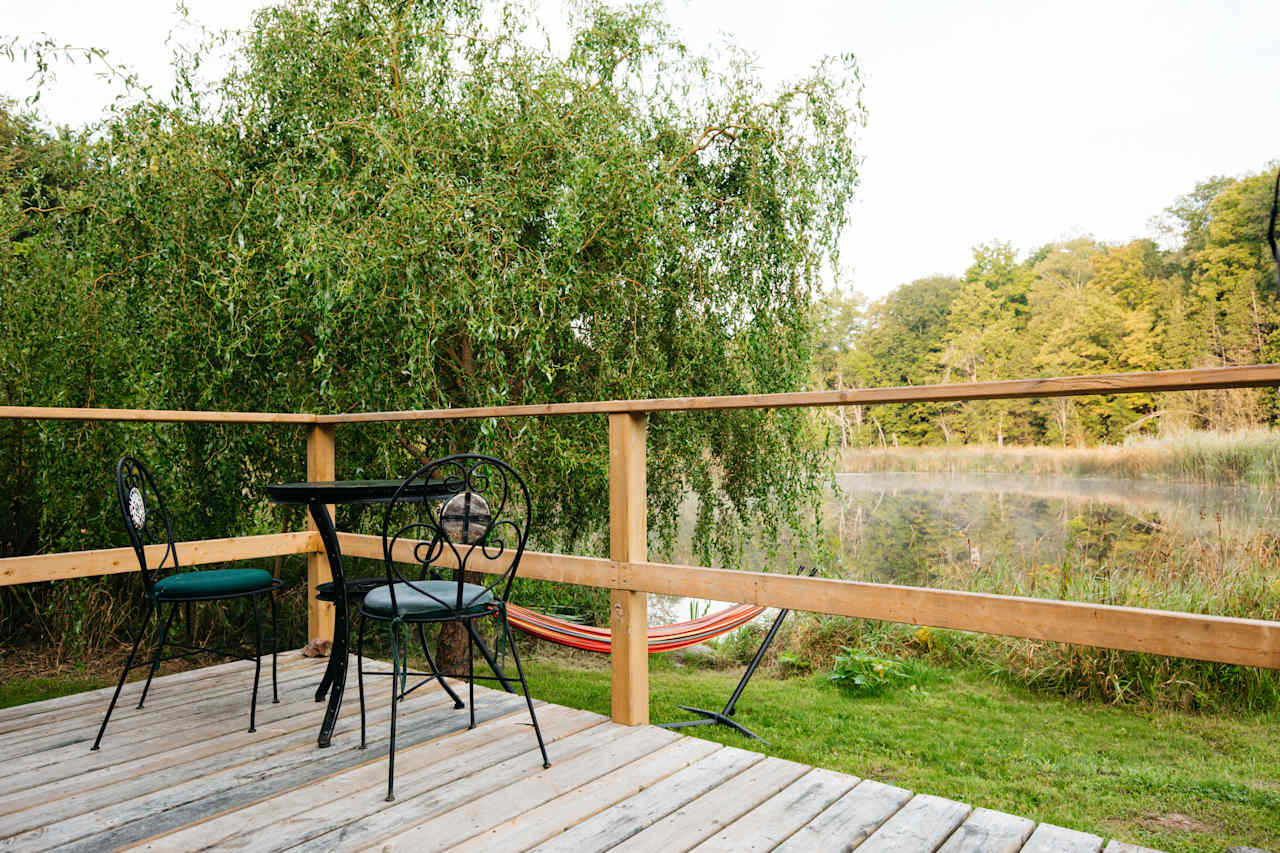 Patio just off the enclosed kitchen with a great view of one of the ponds