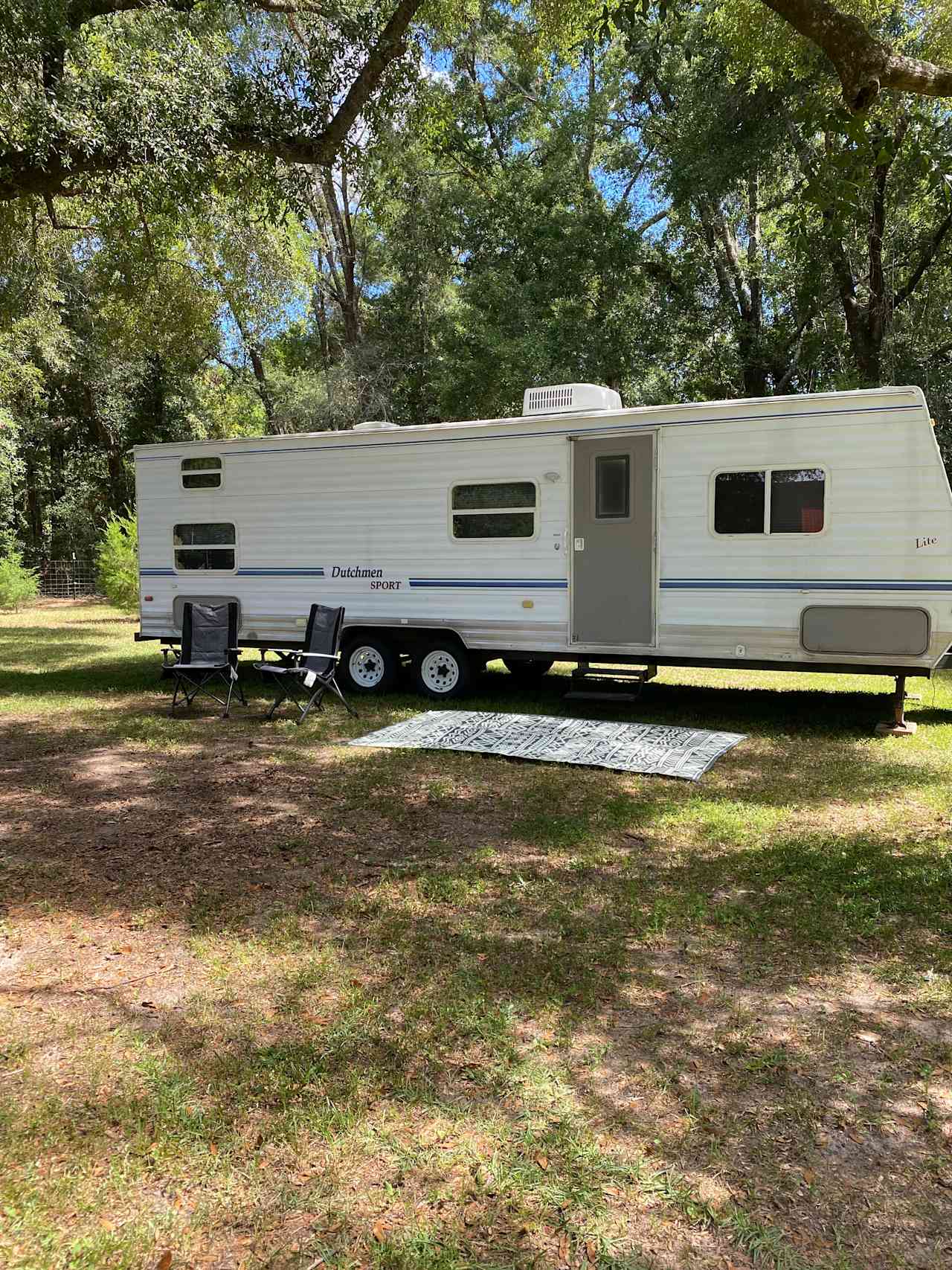 Our refurbished 2003 28" Dutchmen Sport is simple but cozy and is parked at our Long Leaf Landing site.  (*site pictured here is different than Long Leaf Landing).