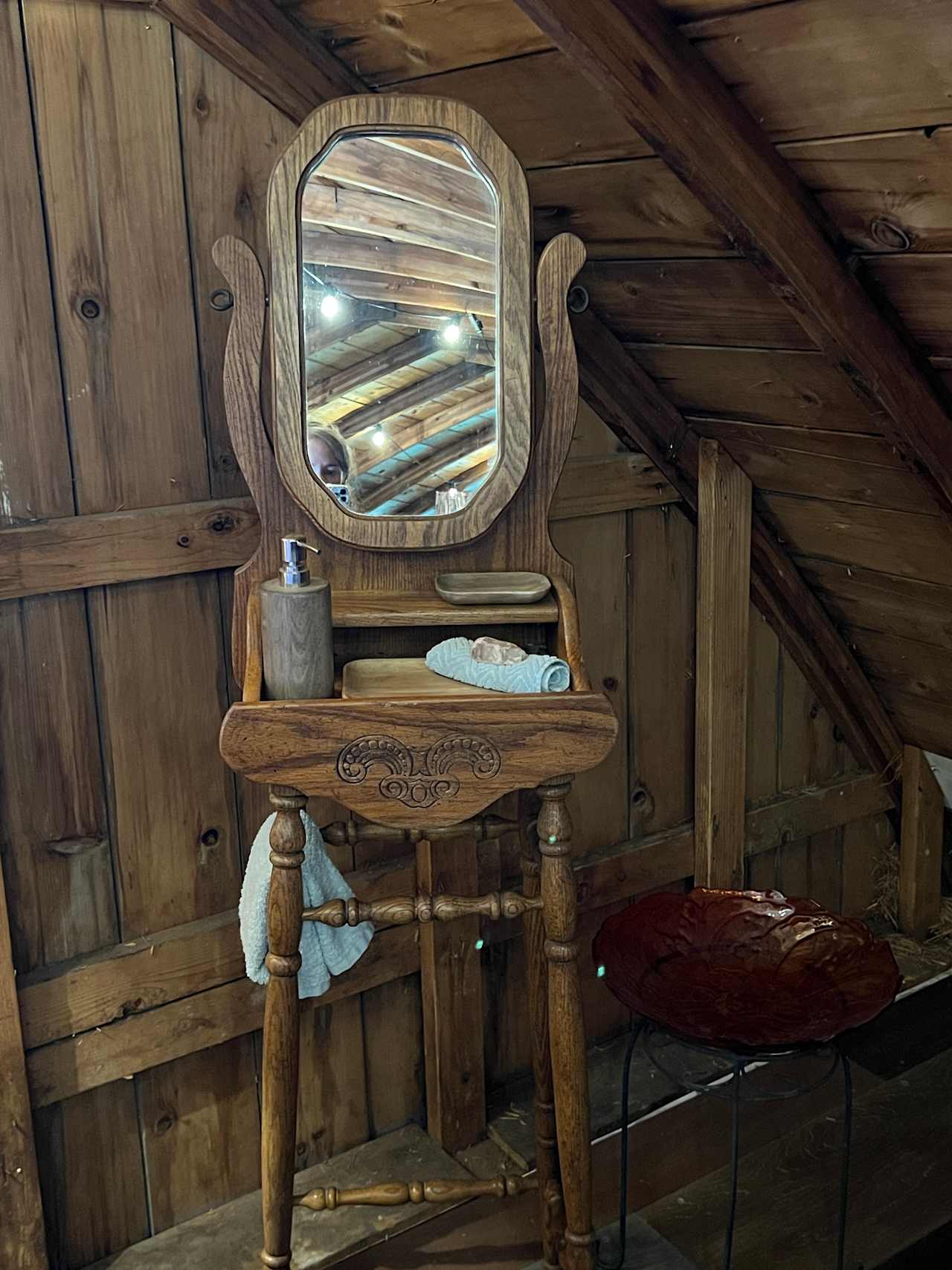 Antique wash stand, with a basin along the side for washing up. Wash cloth, towel, and soap provided. 