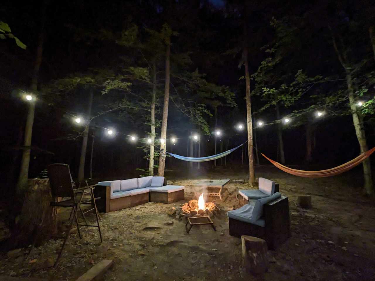 Enjoy comfortable seating, string lights, a propane grill, hammocks, and much more!