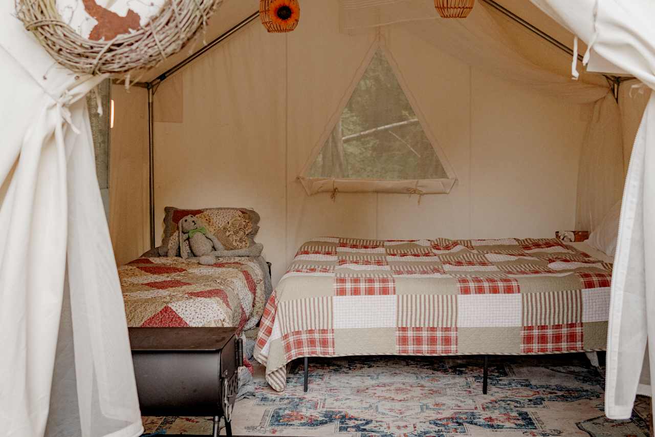 They have a twin sized cot that fits perfectly, so you can fit up to 3 people in the tent!