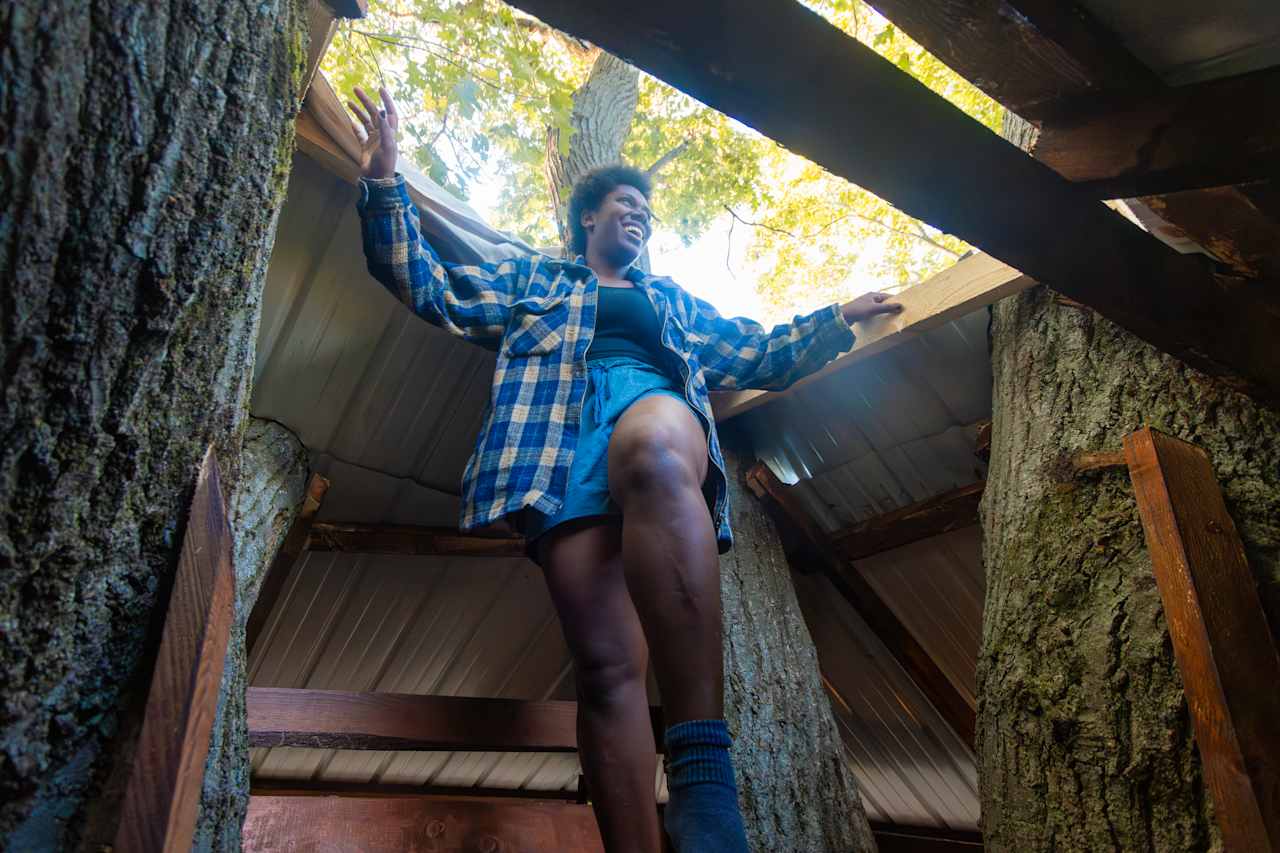 Checking out the view from the very top of the treehouse.