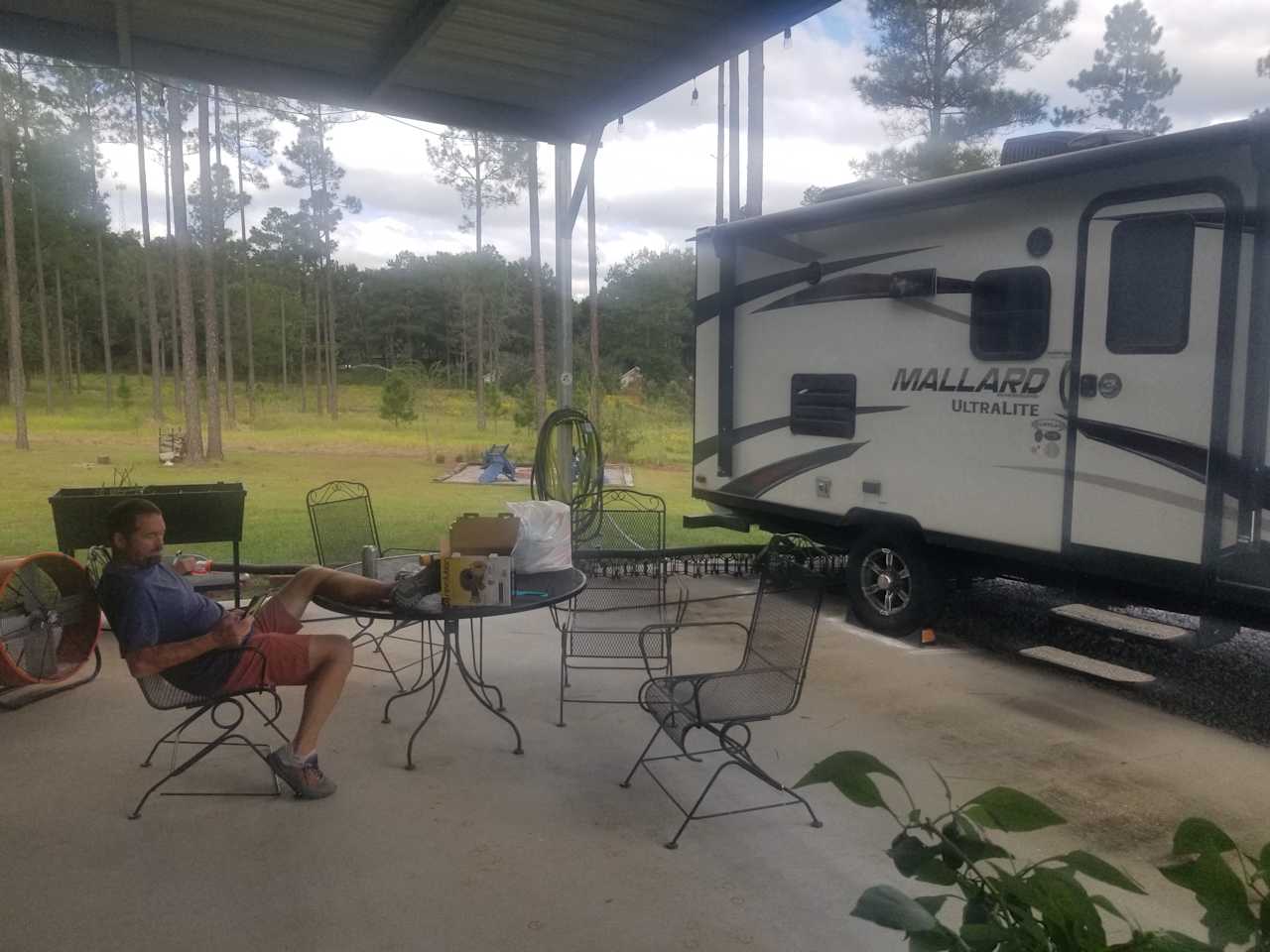 Relax on the patio away from the elements but with view of nature 