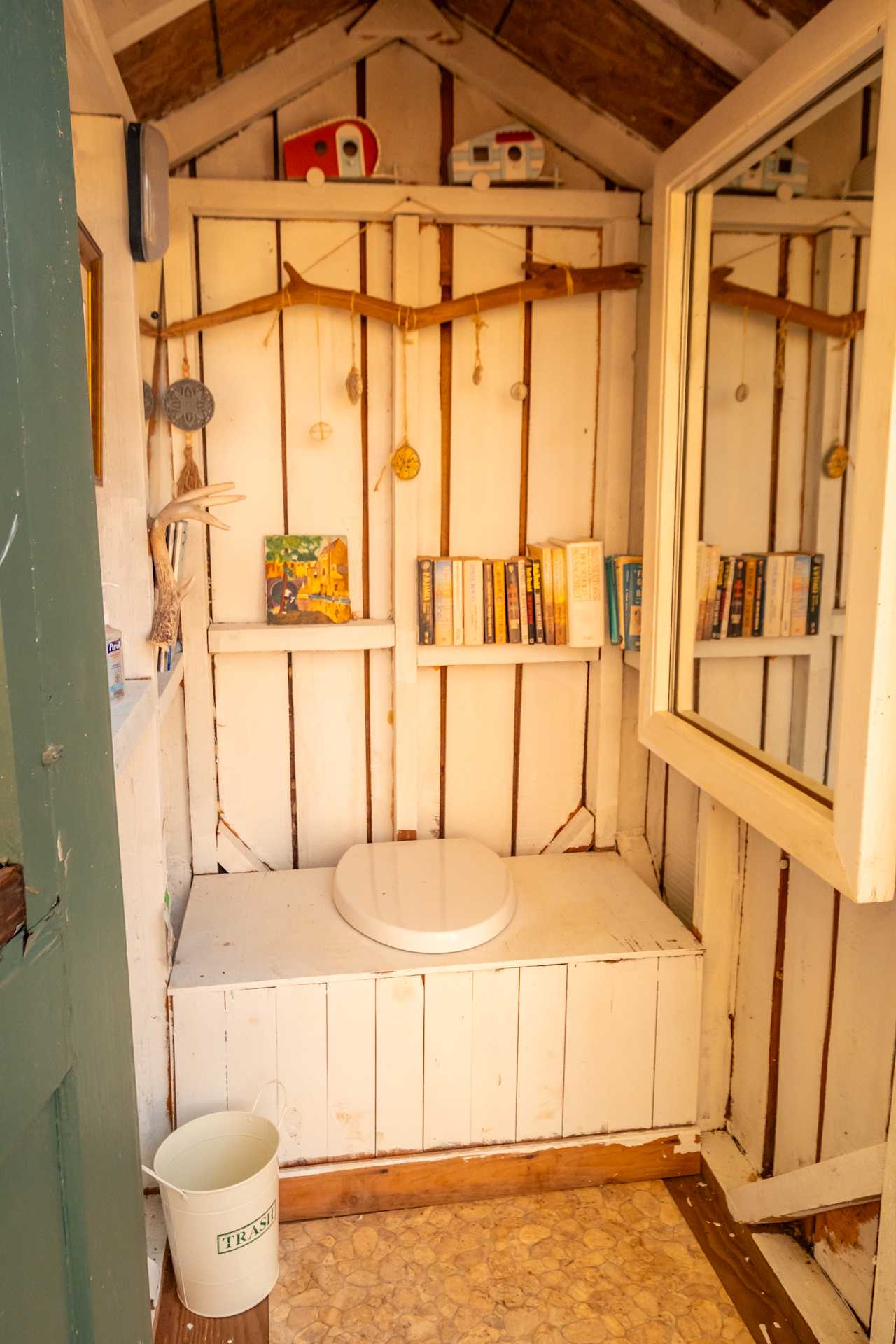 Adorable outhouse/library.