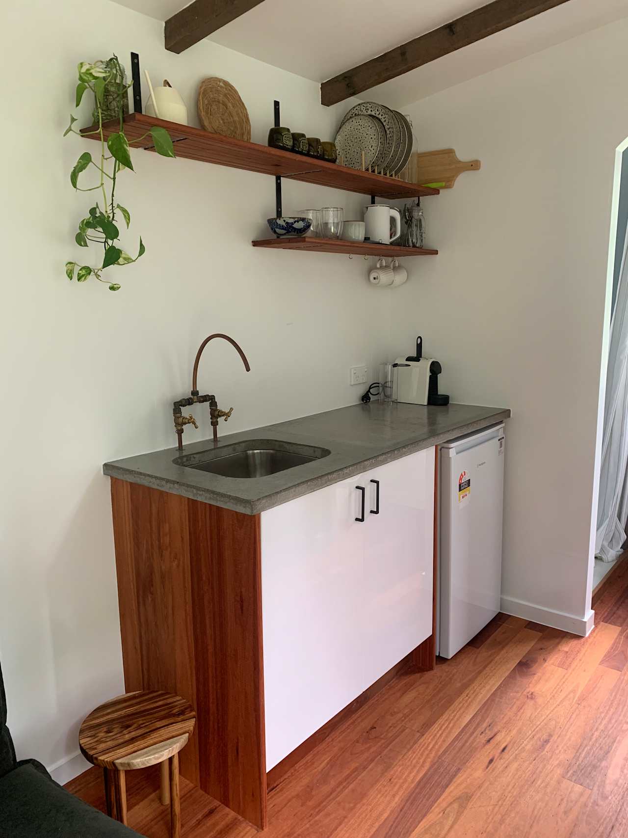 kitchenette with fridge, coffee machine, kettle toaster.