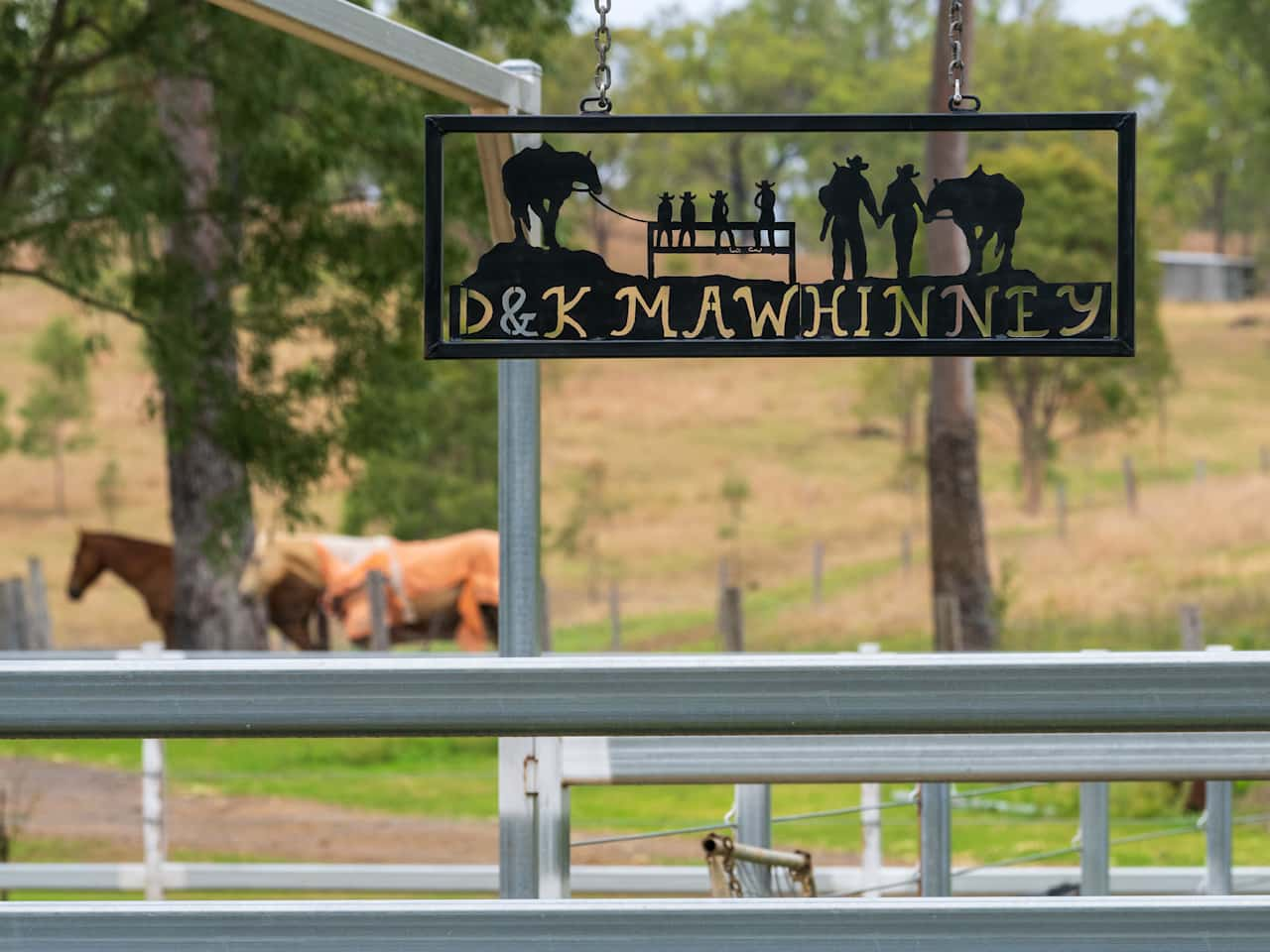 The entrance to the property, the sign depicting the lovely family.