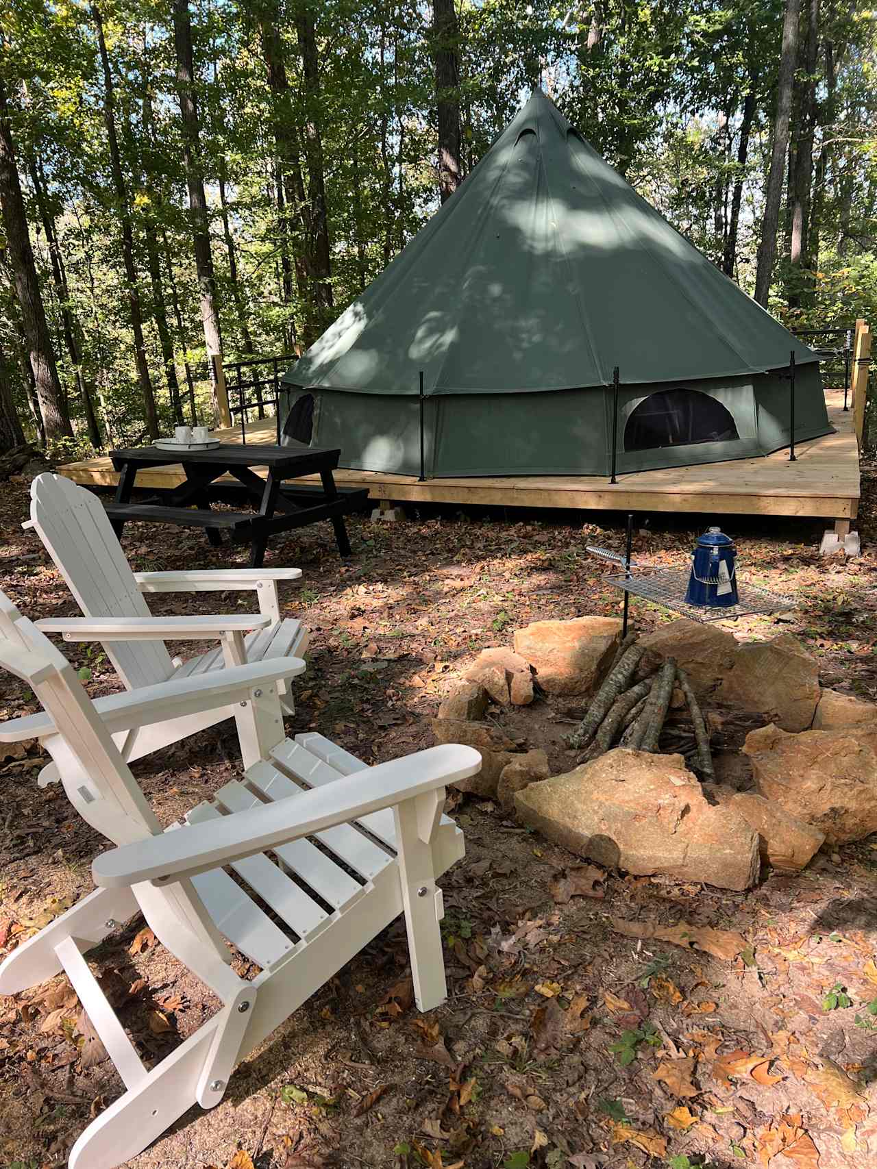 Our Hazel Tent Site is a drive up site that includes a picnic table, fire-pit with grill rack and chairs to sit and enjoy the view from.