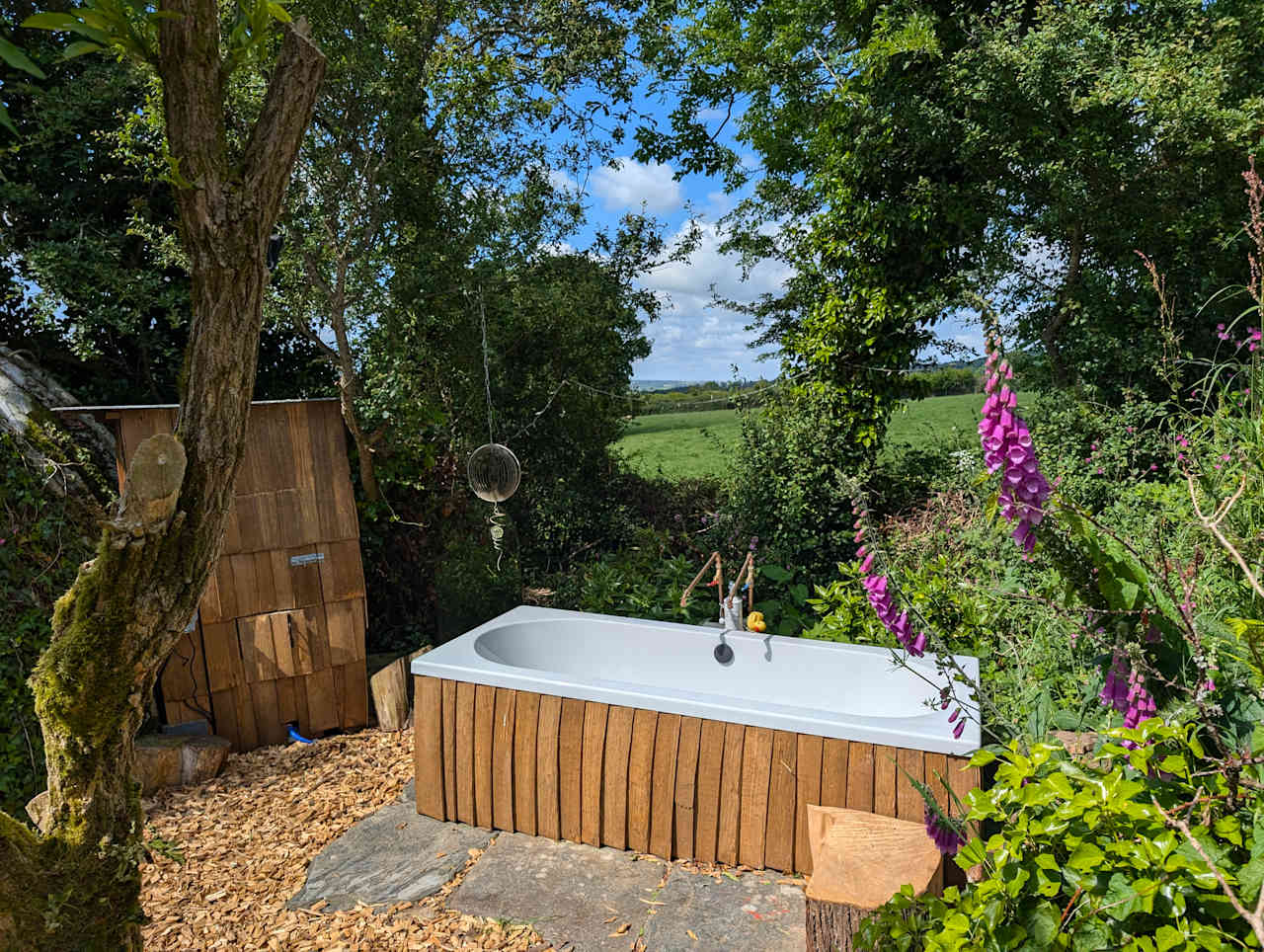 Outdoor hot & cold plunge tub in the secret garden of Dreckly cabin