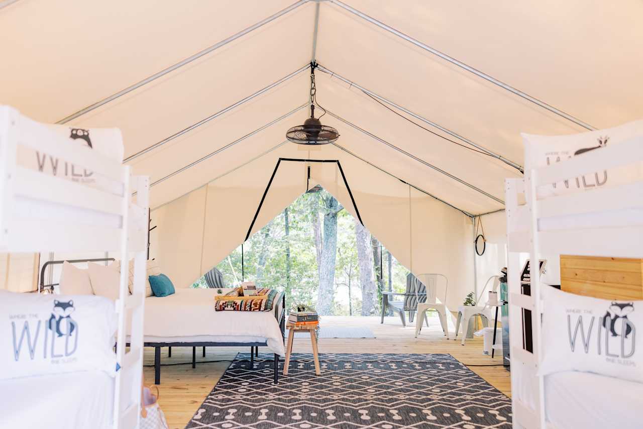 Glampsite #58 - large tent with king and 2 sets of bunks. Back porch faces the lake!