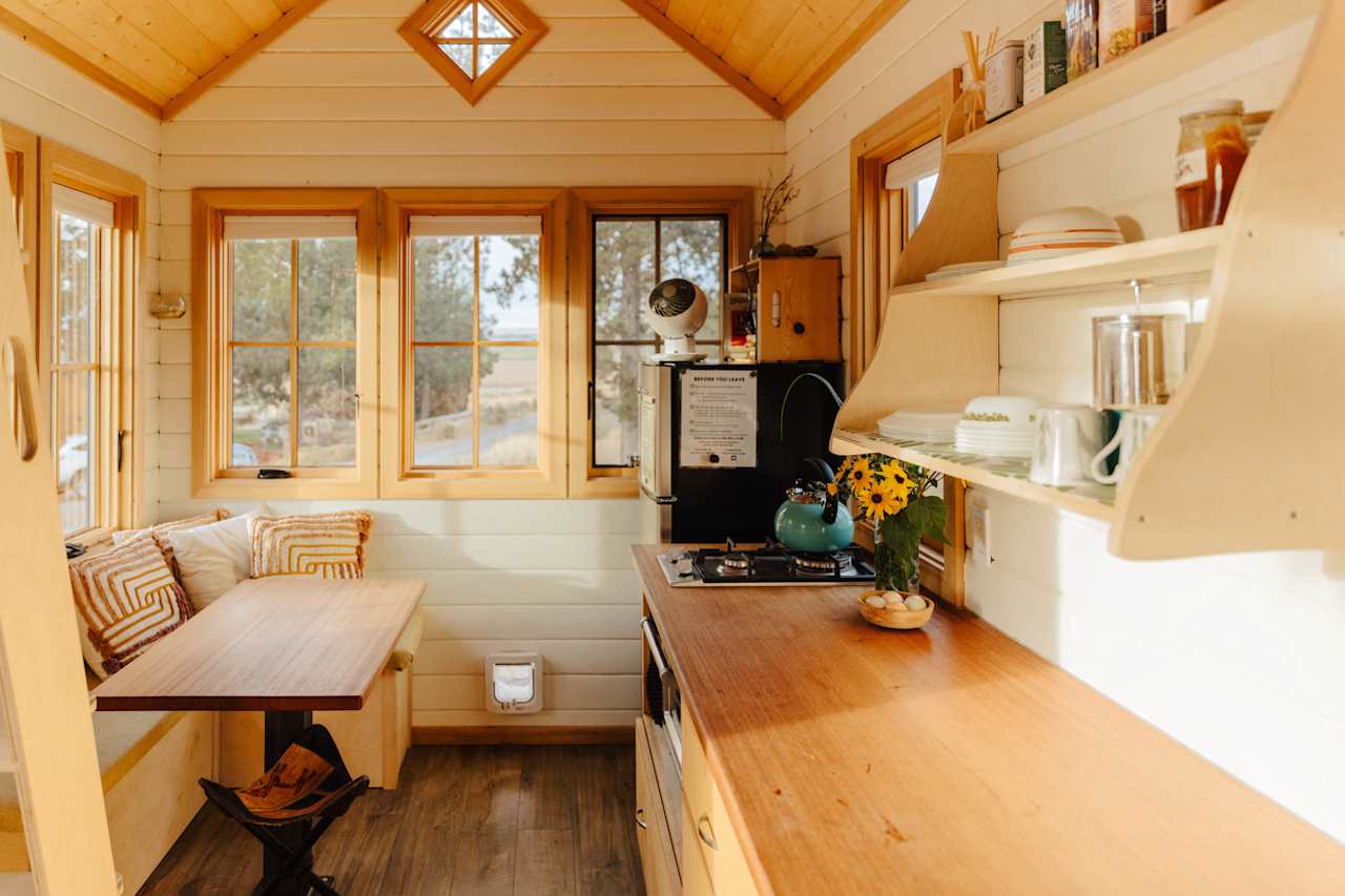 Inside the tiny home with a cozy corner table