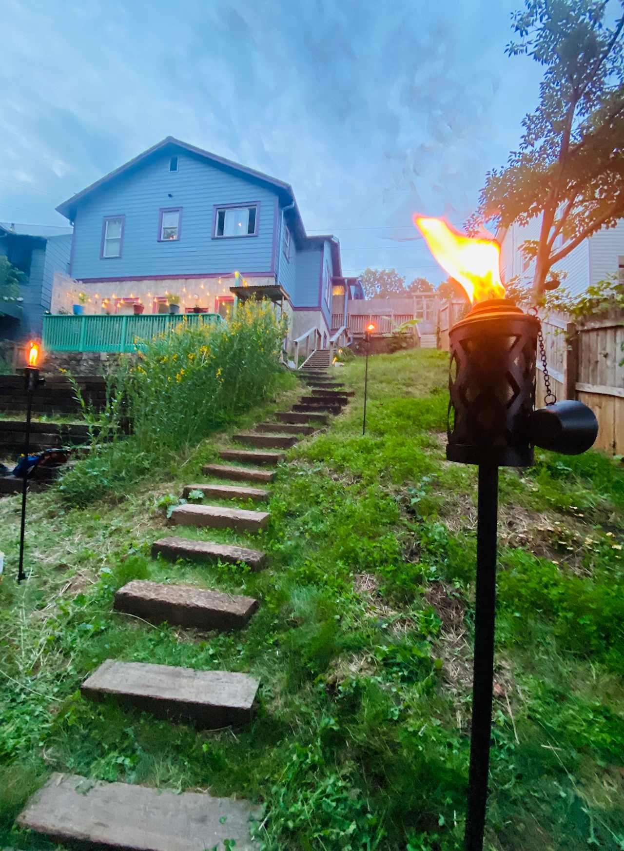 Tiki torches and twinkle lights set the tone for a magical eve in the gardens