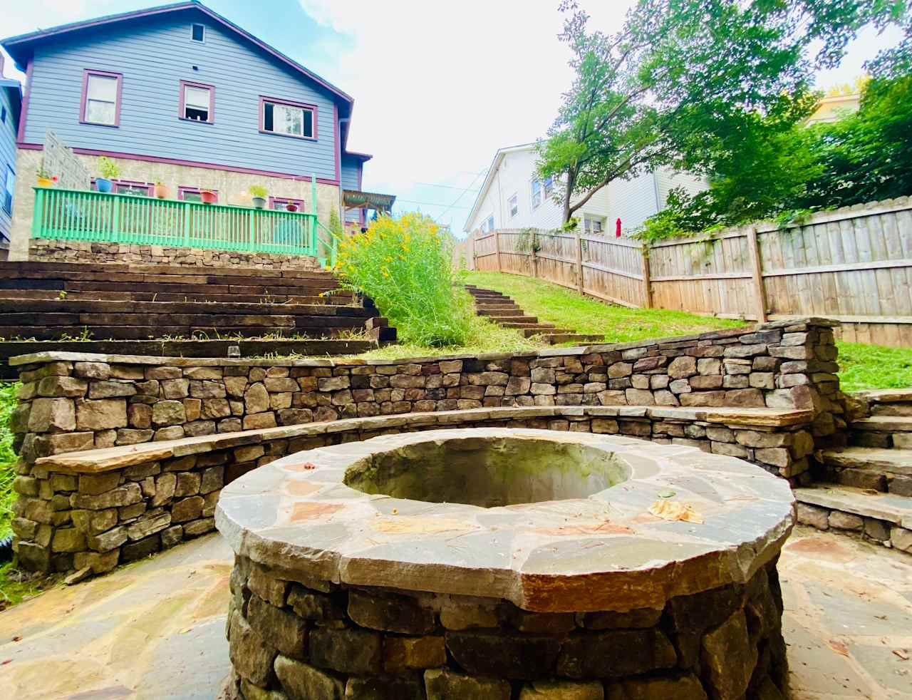 Our stone fire pit & surround seating support connection, reflection & fun around the fire! A custom grill grate and S'mores sticks encourage cookouts