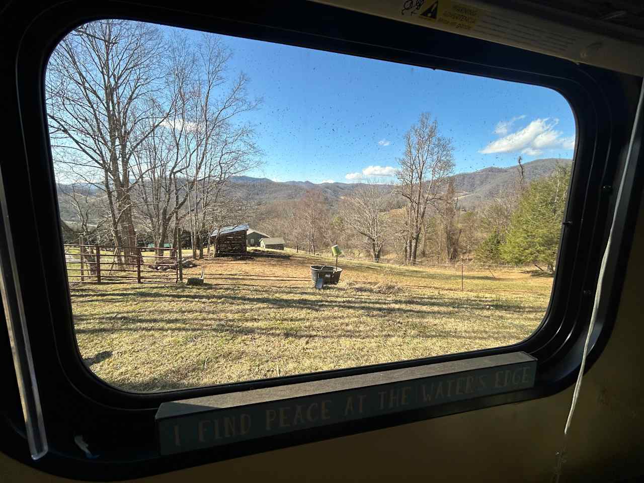 The literal view from the window :) Faces out towards a panoramic mountain view and equine and goat pastures.