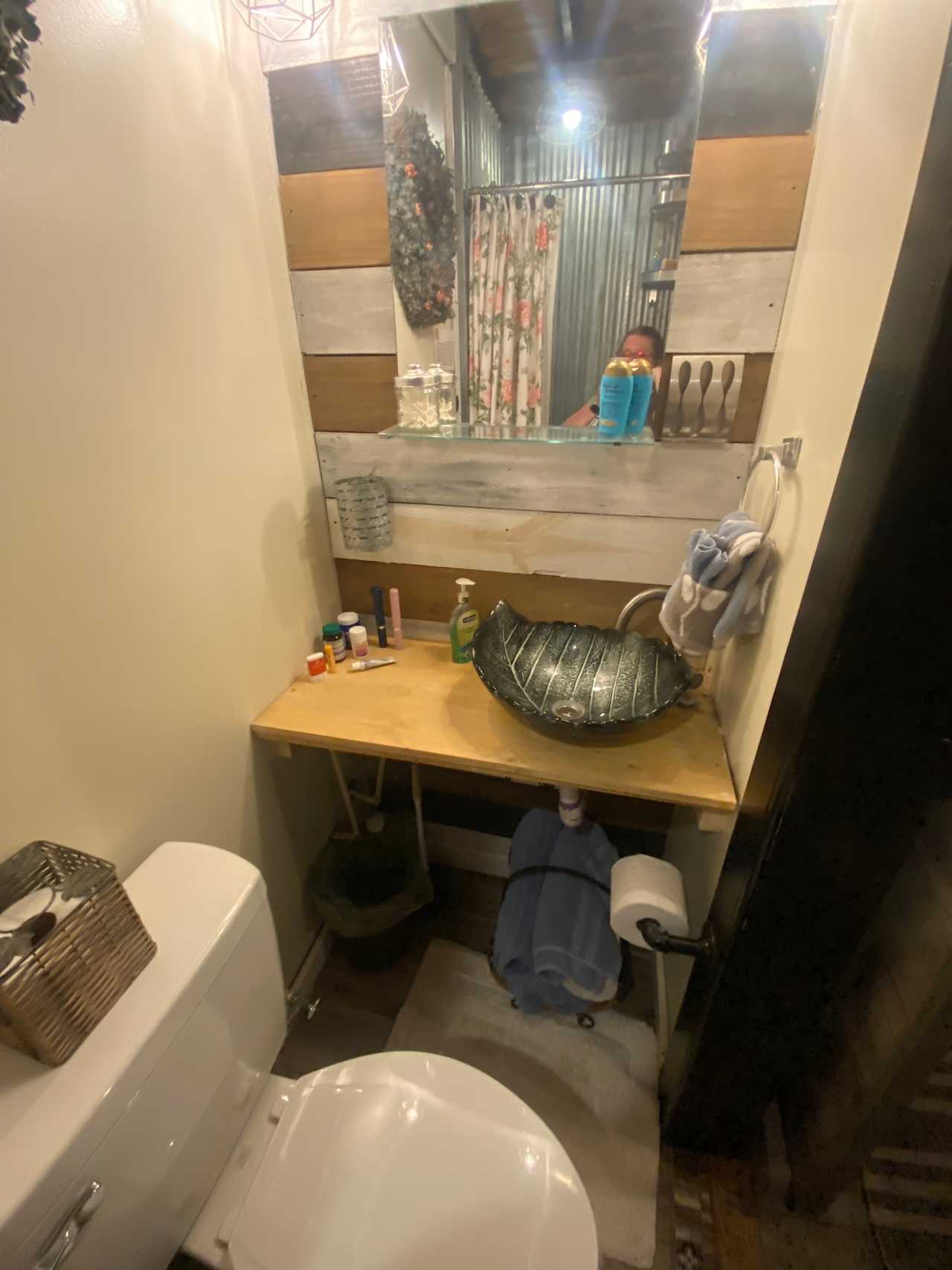 Adorable sink and toilet, small but functional area