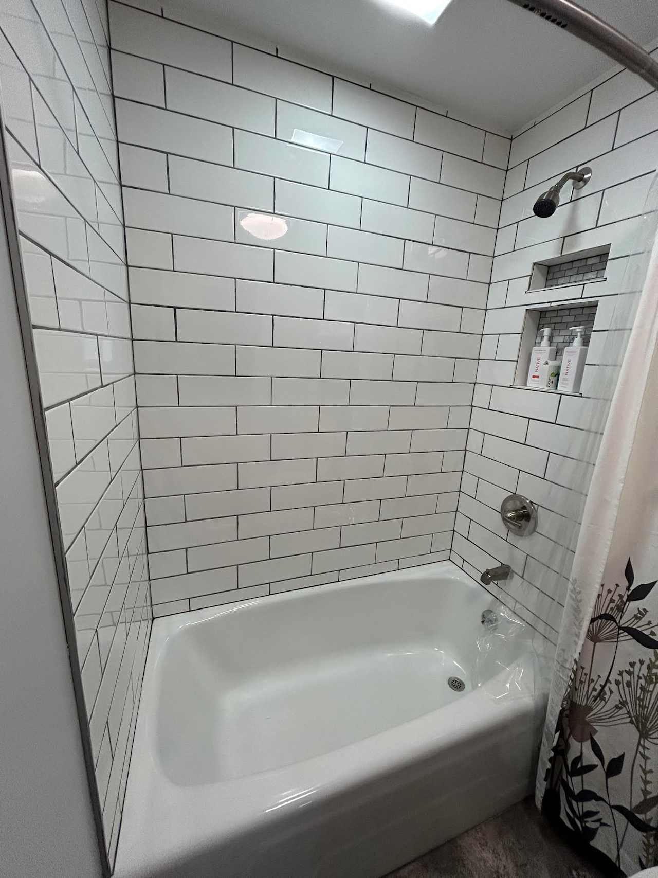 The bathroom has recently been renovated. 