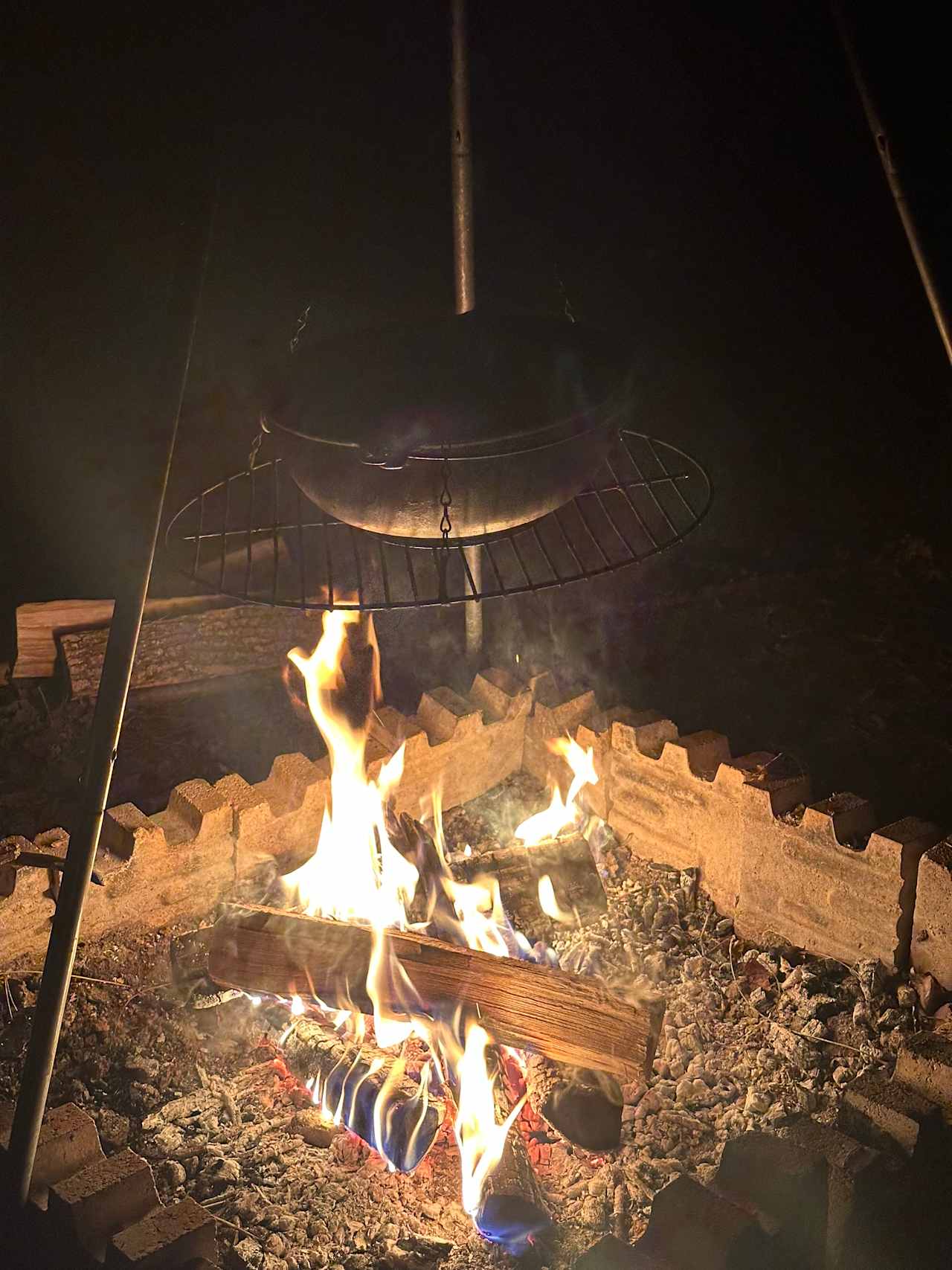 Love cooking over a fire!! The tripod is included, the cast iron bowl is ours. 