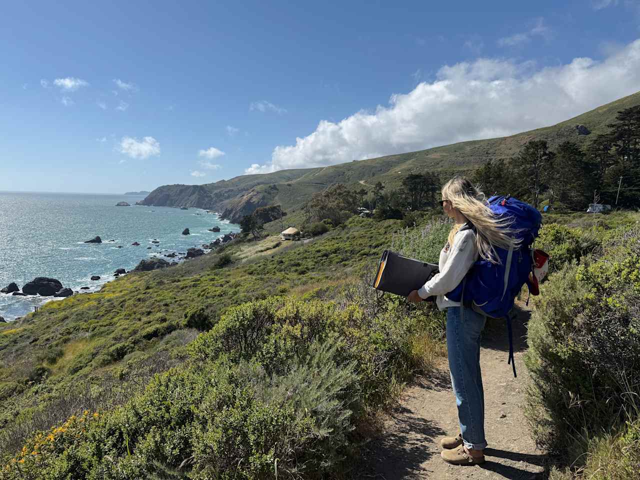 The meadow is about a 1/4mi hike (on a single track trail) from the parking lot
