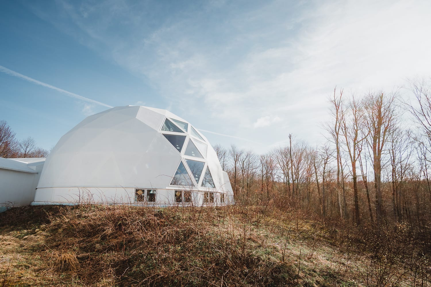 This geodesic dome with a passive solar design serves as the future home of a kitchen and bathroom. It's the community gathering space.