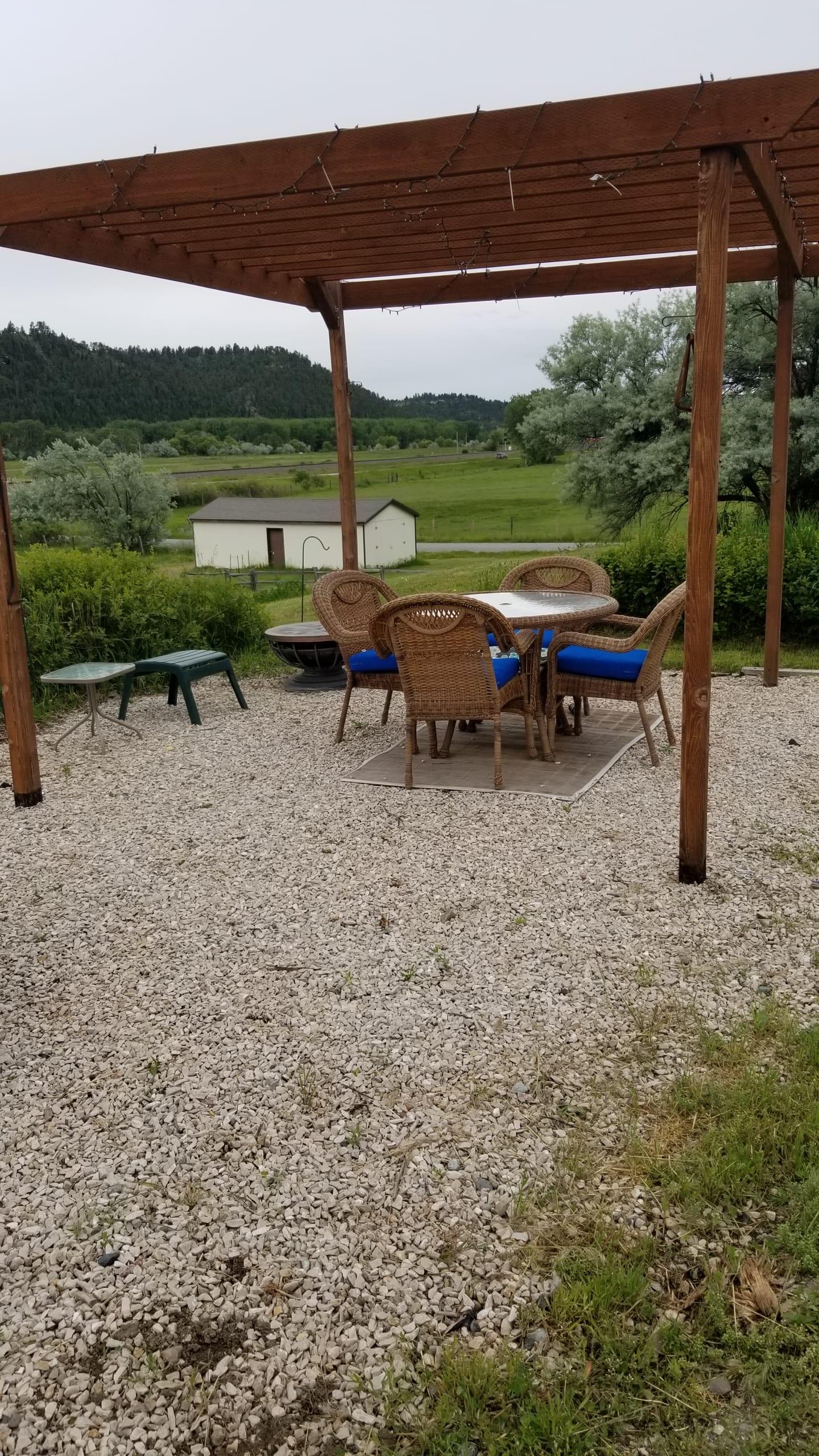 Pergula area with table and chairs available.