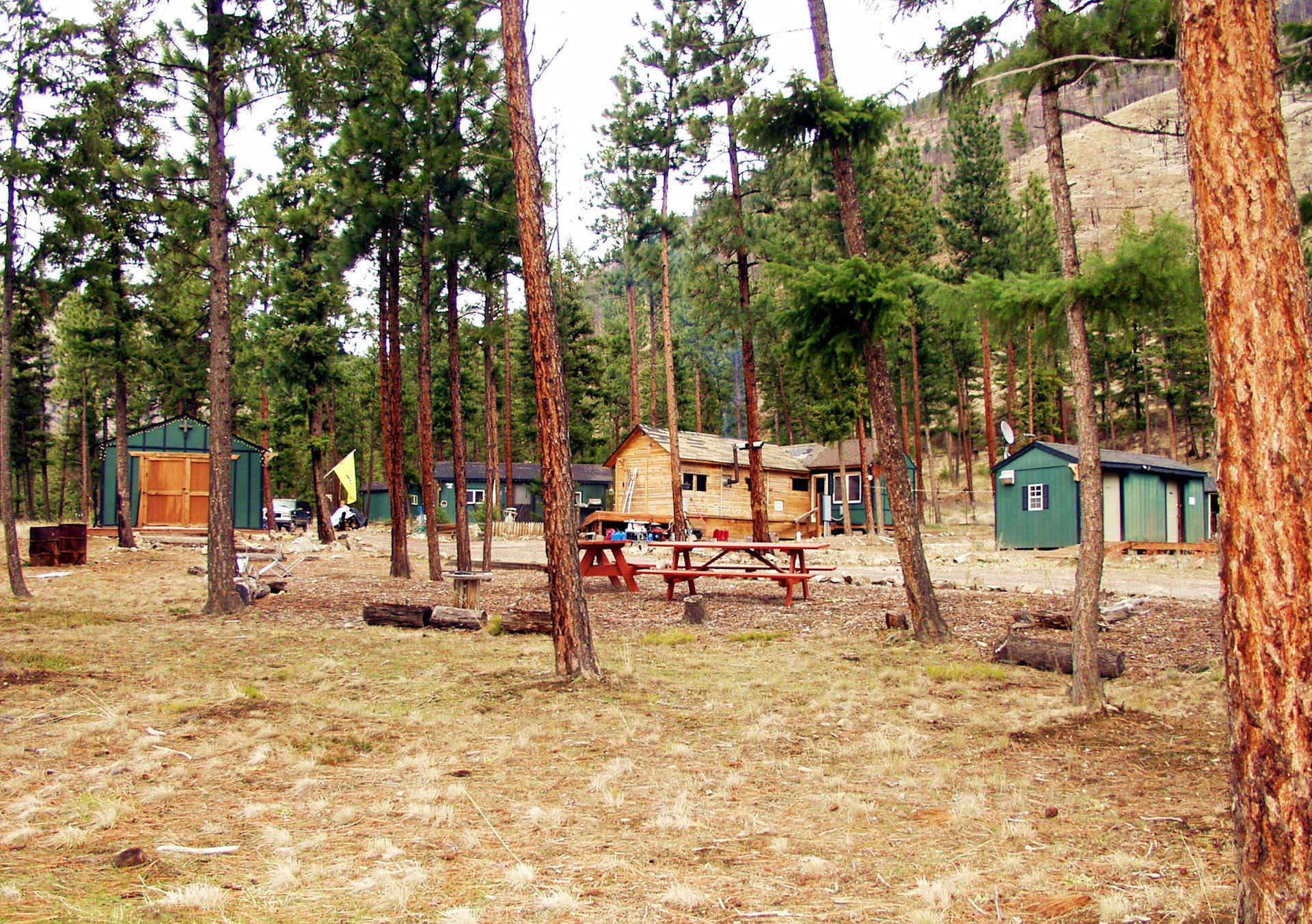 Picnic tables and view of lodge and cabins.