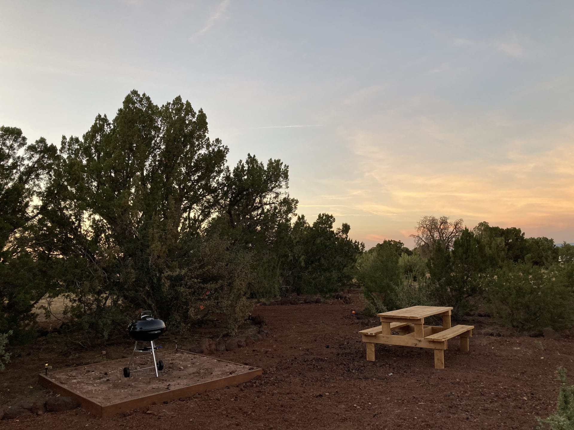 Grill area and picnic table with always the best sunsets! 