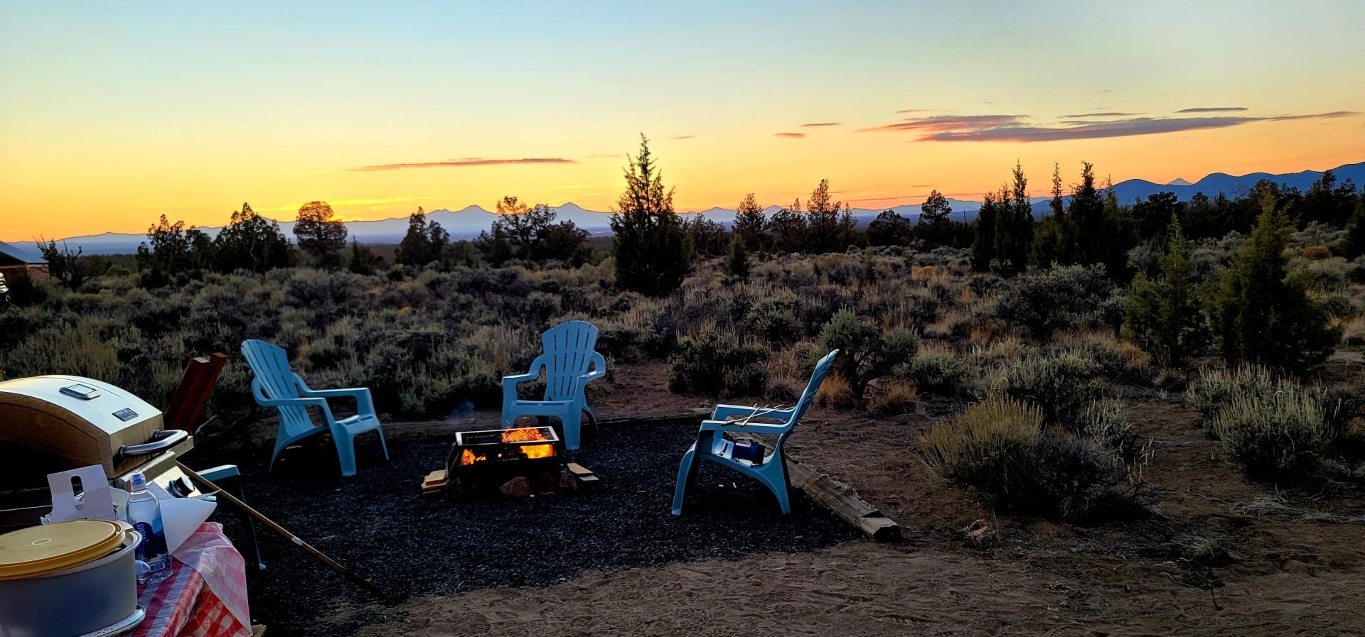Sunset with the fire pit and sitting area