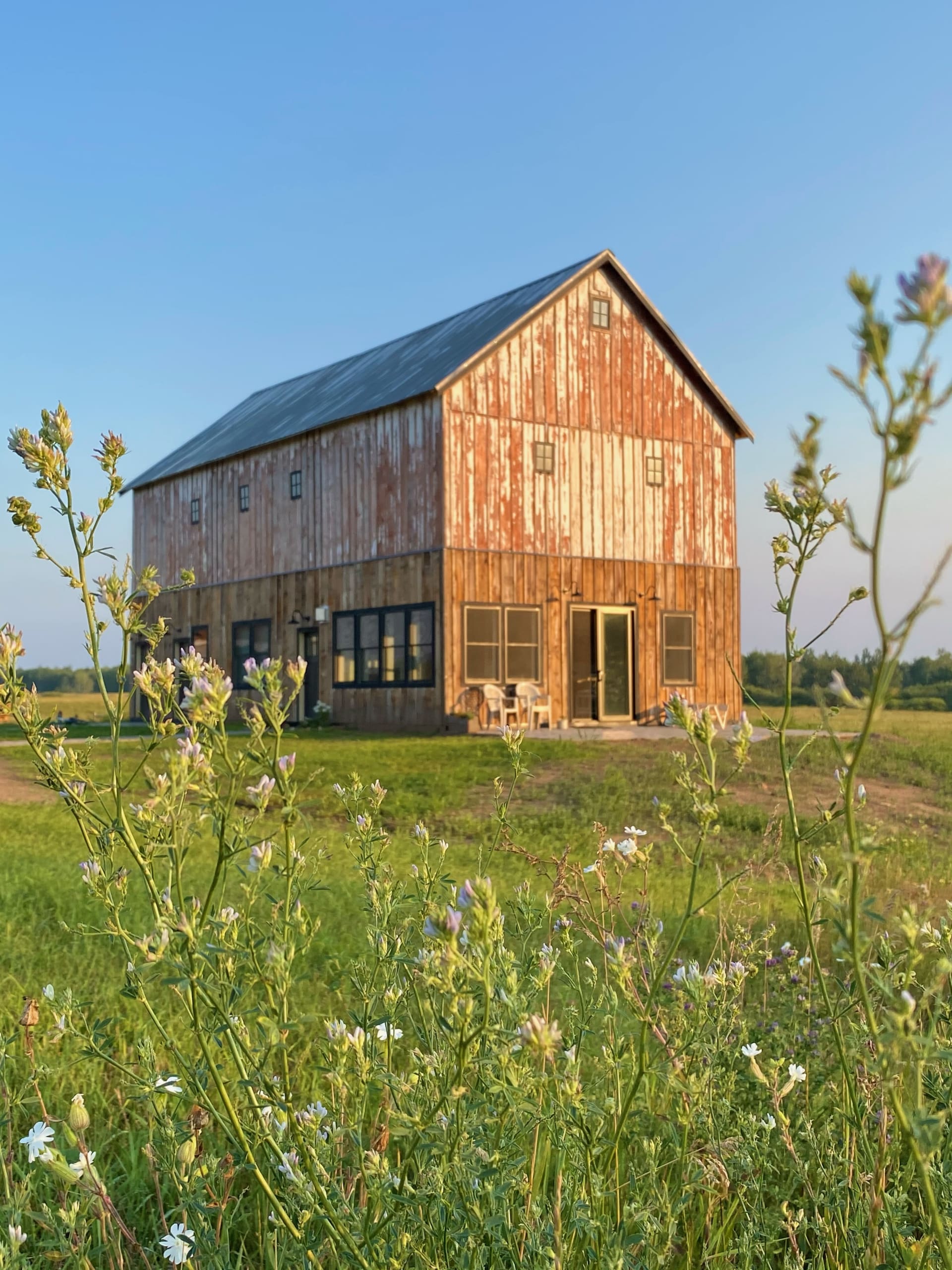 The Timber Frame Barn Stay is in the center of the farm and has a patio overlooking the pond.