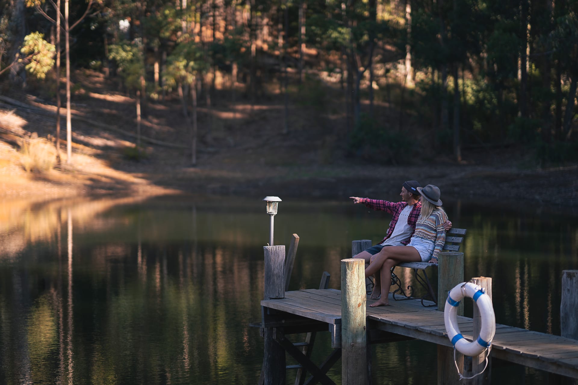 Two campers sat at the end of the jetty, watching the wildlife and relaxing by the dam.