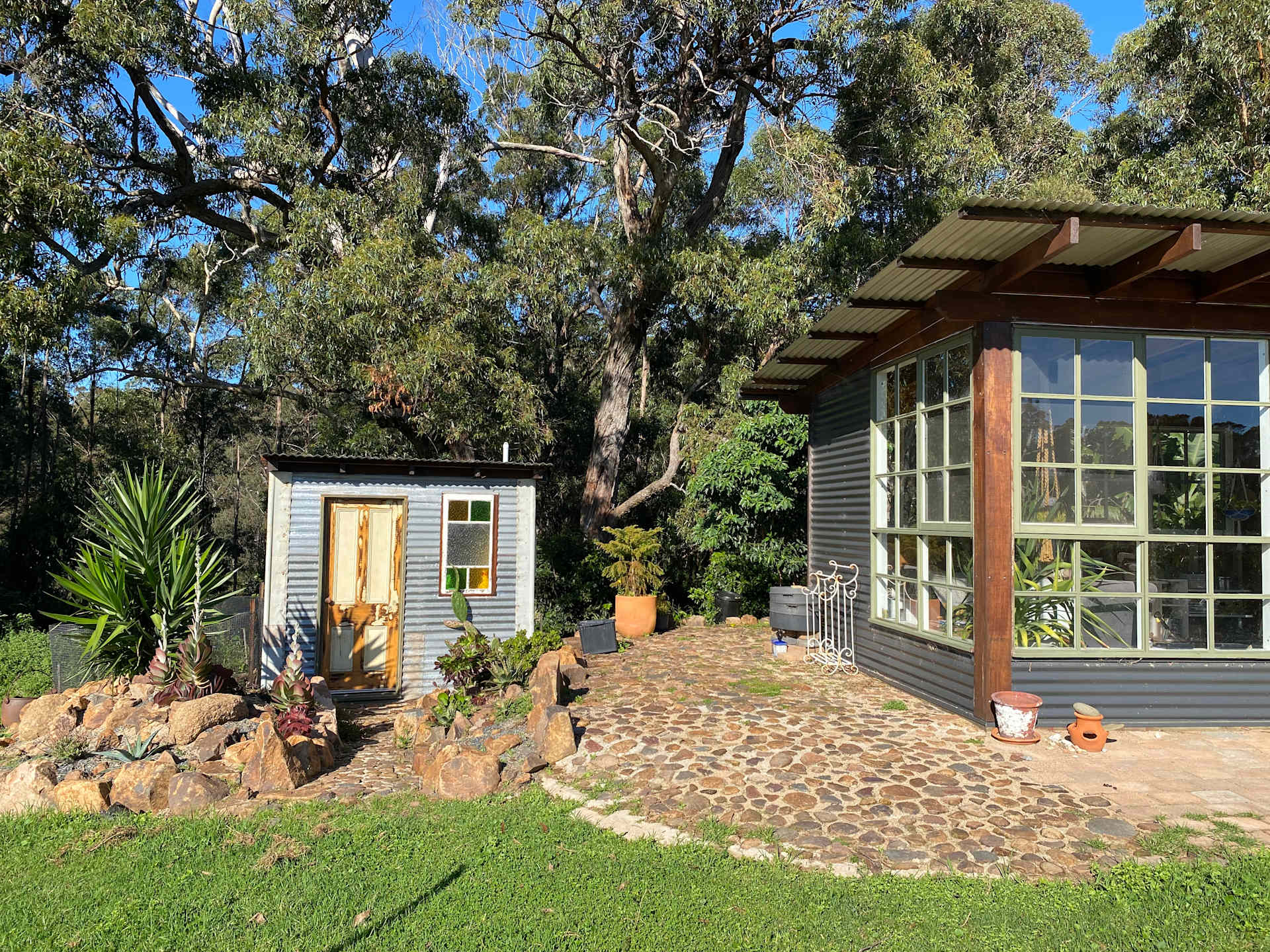 Outdoor bathroom and Bunga shack on right 