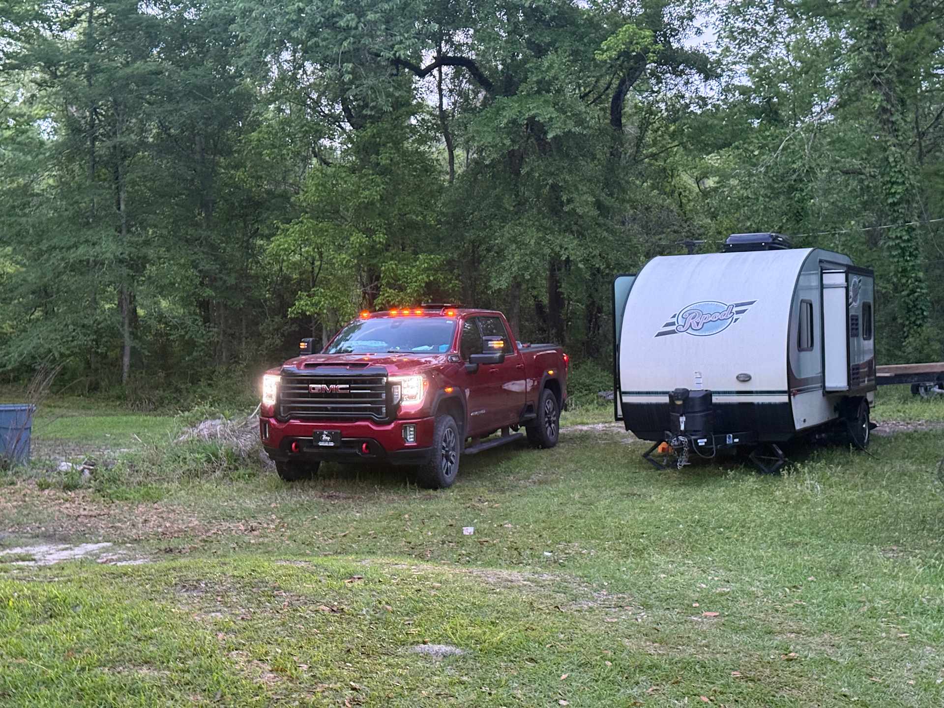 RV site- passenger side of truck has a large hole (maybe was a burn pit at one time)