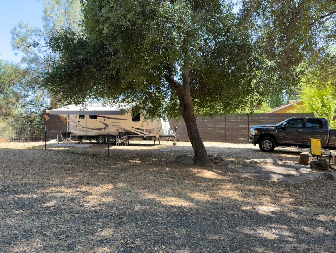 Shady spot with full hookups!  Does have a view of the northern sky so Starlink WILL work here.
