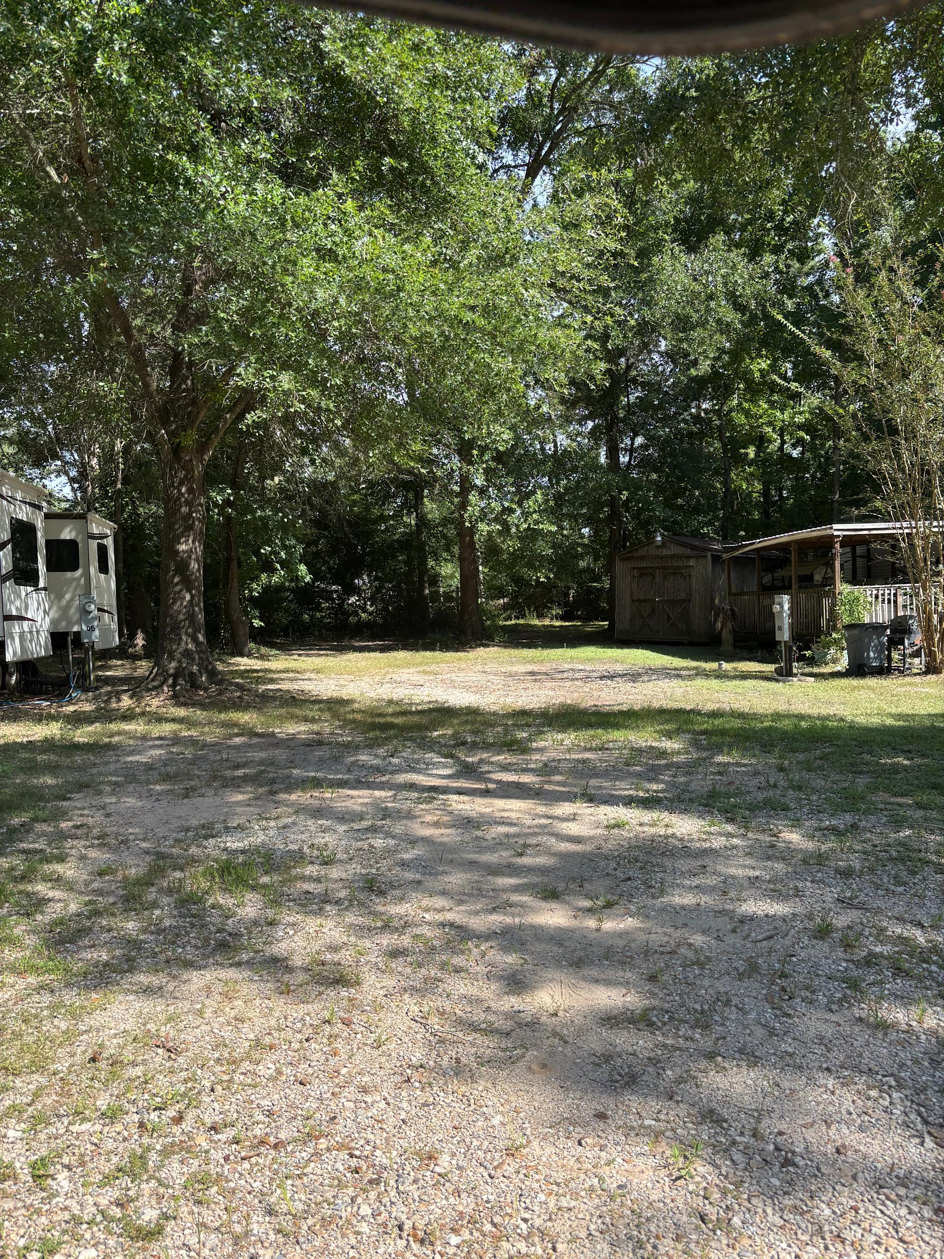 Site 8 gravel back in with trees as shade