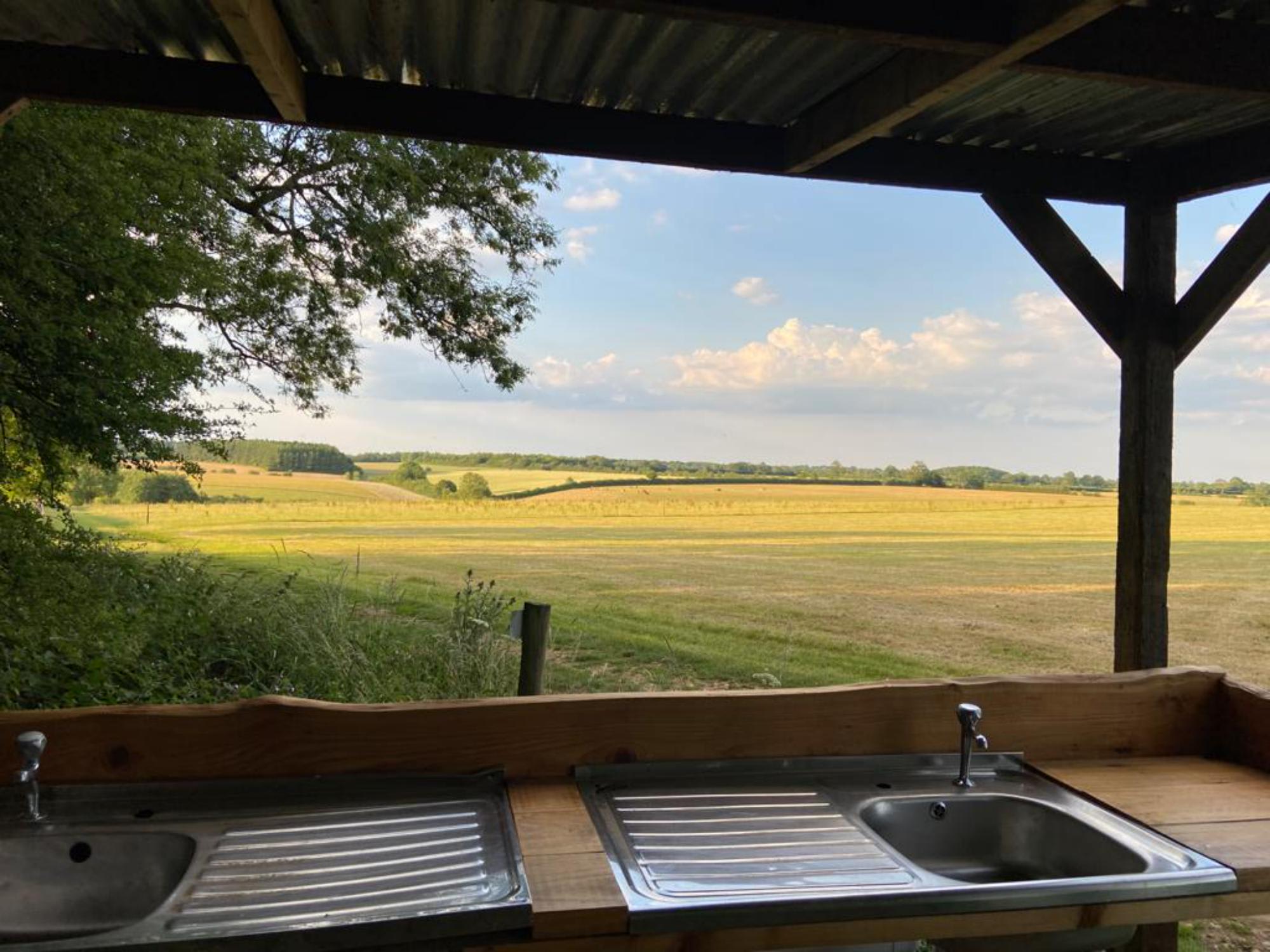 Cold water washing up station with a lush view