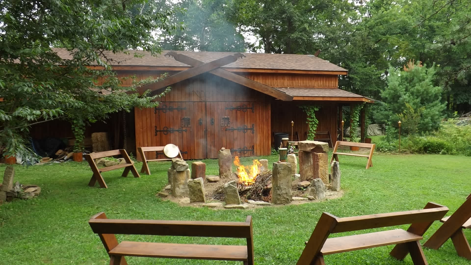 The main longhall building and communal fire pit.
