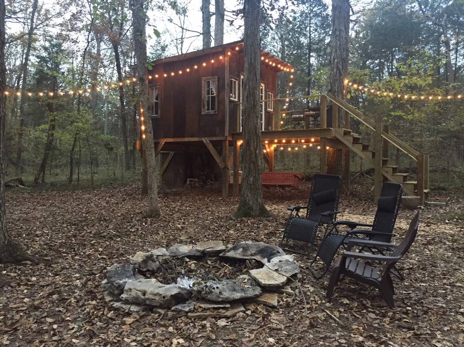Adult treehouse with fire pit and hammock