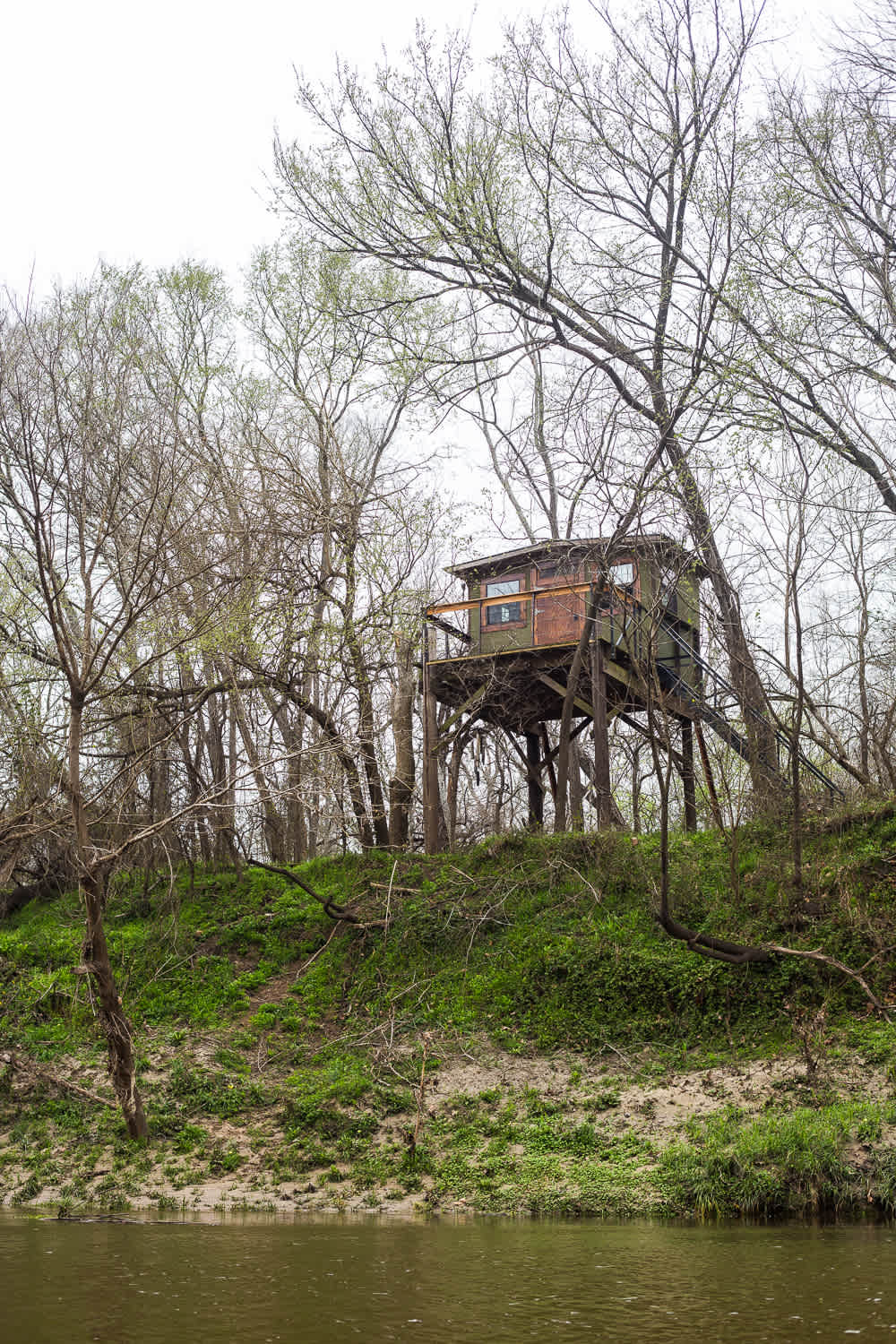 View of the beautiful treehouse from on the water.